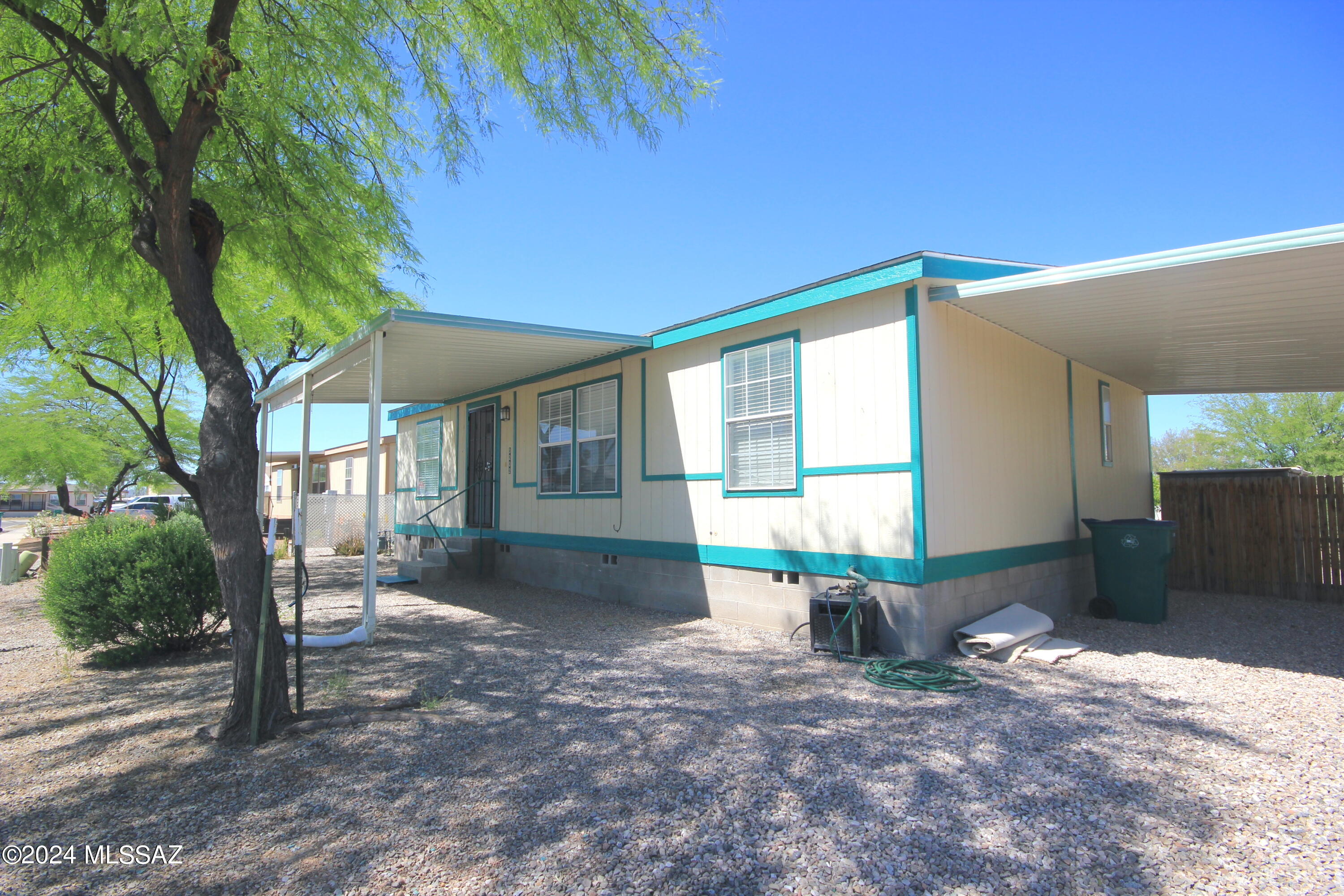 Sweet home that has been freshly painted and carpeted. Very tidy, small development tucked away in a quiet location.  A new roof will be completed by close of escrow. MU zoning. Tile floors. Completely fenced in yard! Split floor plan with ceiling fans  All appliances stay including washer/dryer. Convenient to I-10. Low HOA will increase to $200 ANNUALLY in 2025.