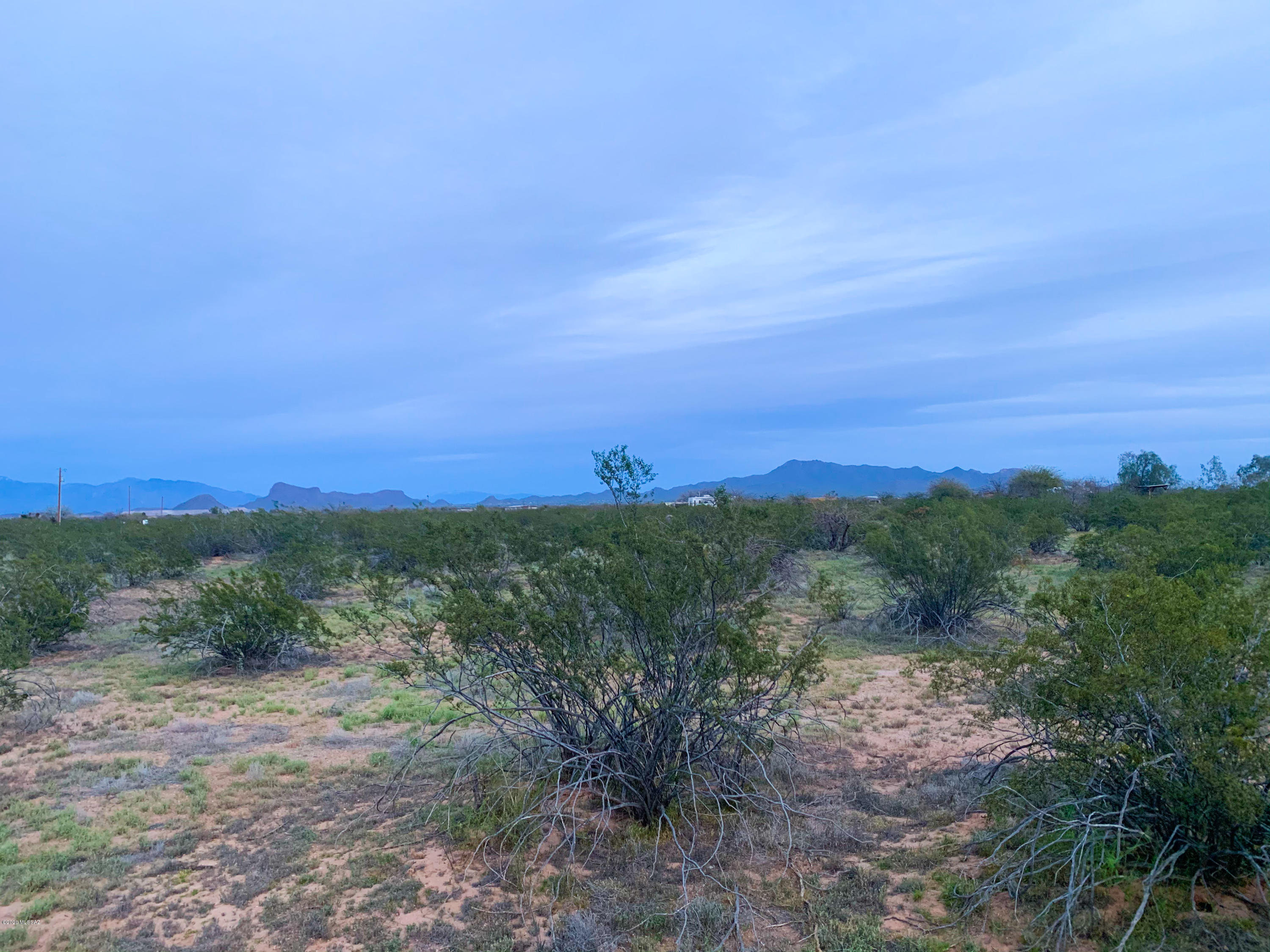 Get away from the noise of the city and take in the peaceful beauty of rural Marana.  Gorgeous 360 degree views of mountains, blue Arizona skies, stunning sunrises and breathtaking sunsets. 5 acre corner lot has loads of possibilities!  Nice and flat terrain, easy build for manufactured home or single family residence and more w/ flexible RH zoning. Huge value as this lot already has a shared well in place and electric on site. Plenty of room for toys, horses or farm animals...Make this slice of heaven yours today!
