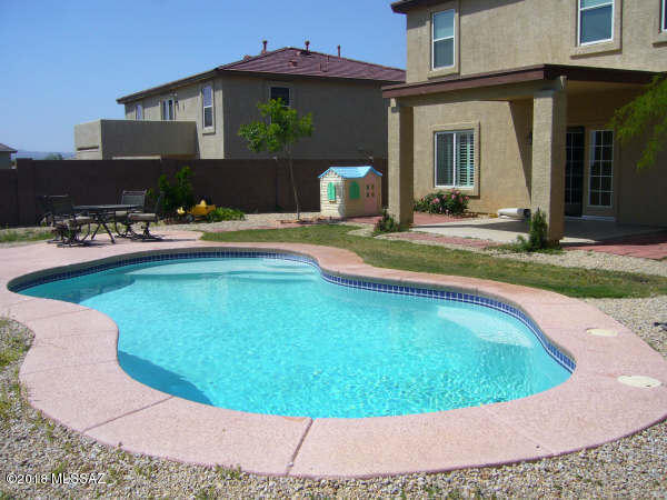 Spacious home with loft, breath-taking Catalina Mountain views.  2261 square feet, with gourmet kitchen, upgraded cabinets, all stainless steel appliances, self cleaning double oven, wood shutters, covered back patio, and saltwater pool.  Rent includes once a month pool cleaning.