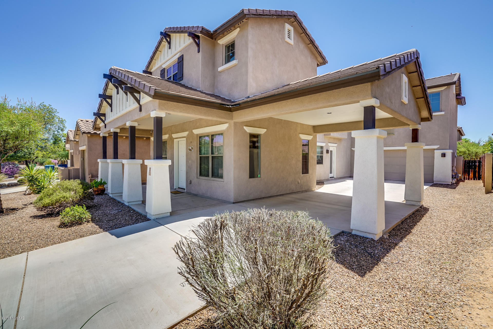 Your beautiful new Richmond American Home is located in the highly desired resort community of Rancho Sahuarita.  You will enjoy every amenity you could want while enjoying this perfectly planned home.  Your home has room to park 6.5 cars and features a carport, 2.5 car garage and 4 car drive way.  Your home has corian countertops, fresh interior & exterior paint, stainless steel appliances, large upstairs laundry room, a loft, great room, family room, designer architecture and a master bath & closet that will make you the envy of your friends.  Easy access to the highway makes commutes and shopping excursions a snap.  All while being walking distance to the heated community pool and parks.  We have pulled out the stops to make your home move in ready.  Are you ready for your keys?