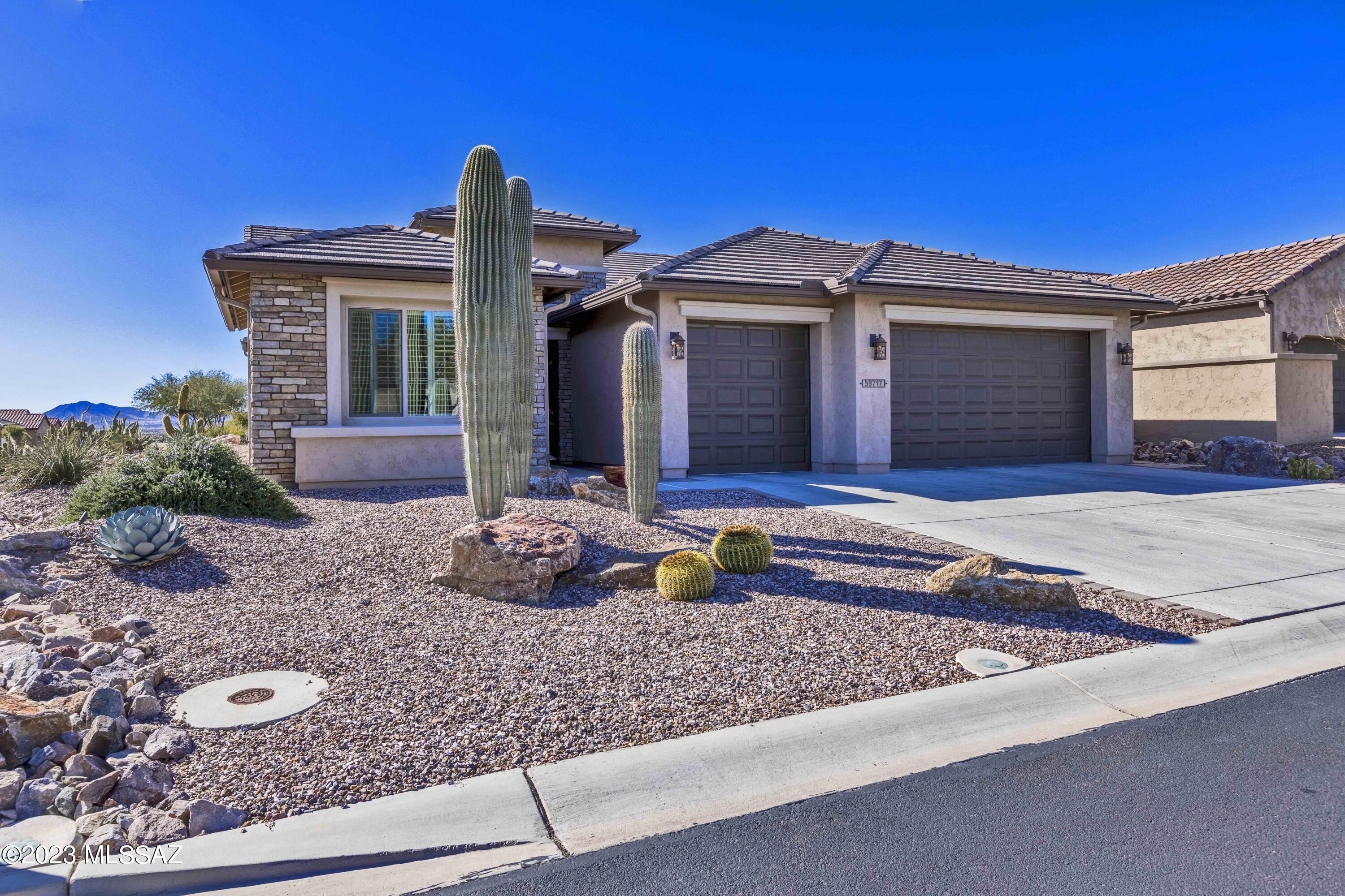 Sought After Fresco Model Home on a Corner Lot w Office/Den.  Enjoy the many upgraded amenities of this home. *Bar/Buffet with full cabinets. *Gourmet Kitchen w/built in appliances, 42'' Upper Cabs, Soft Close & Pull out Shelves * 8' Interior Doors * 5 1/4'' Baseboards * Bedroom Extensions and XL Laundry Room *   3'' Plantation Shutters Throughout & Automated Shades in GR *Full 3 car extended garage, *8' extra tall garage door* Soft Water * Hot Water Recirculation ***Enjoy outdoor living on extended pavered patio w/built-in fireplace *Center Opening Sliding Patio Doors  * BBQ Station *Fire Pit  * Xeriscaping w/Boulders & Accent Lighting * Backs to large common area w/ peek-a-boo views to Catalina & Tortolita Mountains