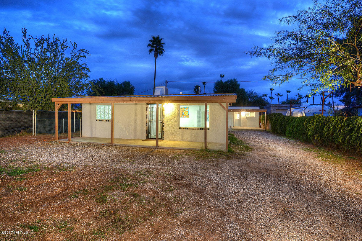 NEARLY NEW EVERYTHING and 2 MILES FROM The University of Arizona! 2 Bedroom/1 full bath Main house + Separate Studio Apartment (built in 1975) w/ Kitchen & Bath. A meticulous remodel awaits you in the heart of central Tucson. Main home features a NEW furnace, central evap cooler, roof coating, and energy efficient windows. Studio features NEW AC and heater, NEW R45 ROOF - still under warranty. Electrical system upgraded in each home. Both homes have been painted inside and out and feature ceramic tile throughout (no carpet). Enjoy generous covered porches and patios for Tucson’s outdoor living. Separate meters for electricity and washer/dryer hookup is available behind studio/guest house. Property also listed as Res. Income MLS#21705464.