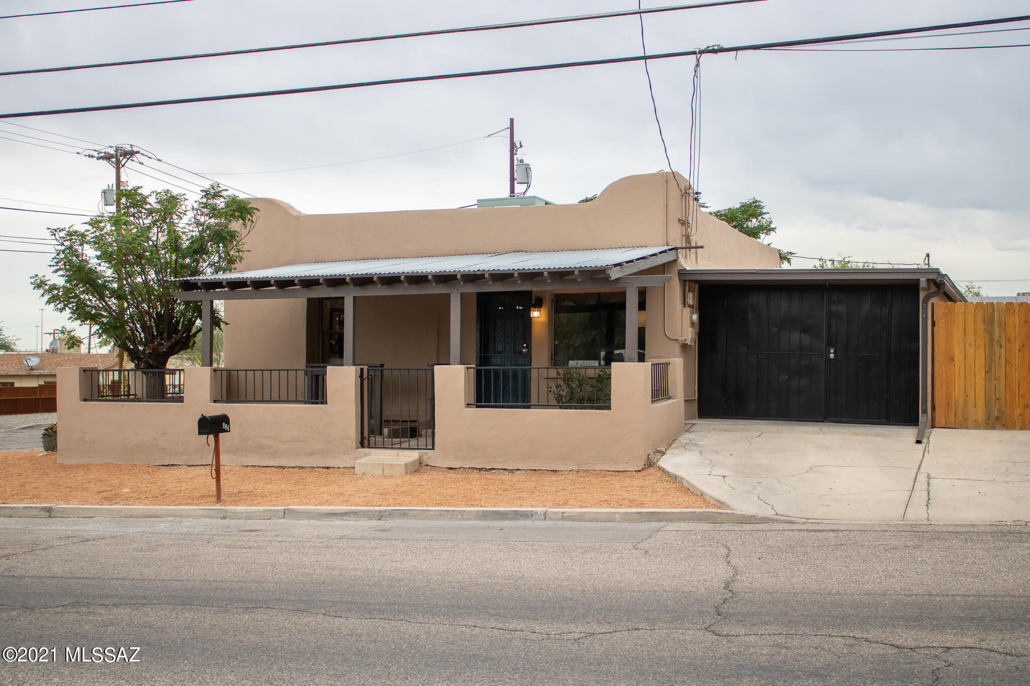 Cozy bungalow style home located on a convenient corner lot in the desirable Barrio Viejo (''Old Town''), one of Tucson's oldest historic neighborhoods. This home boasts beautiful quartz countertops, stainless steel appliances, new tile floors and new carpet throughout and much more! Basement bonus room which can be used as a ''man cave'' or storage room. Spacious secure backyard with carport. Easy access to Interstate 10, close to U of A, and world-famous gem show. Located four blocks from downtown with views of ''A'' mountain and Tumamoc Hill from your front porch. Enjoy this perfect location!