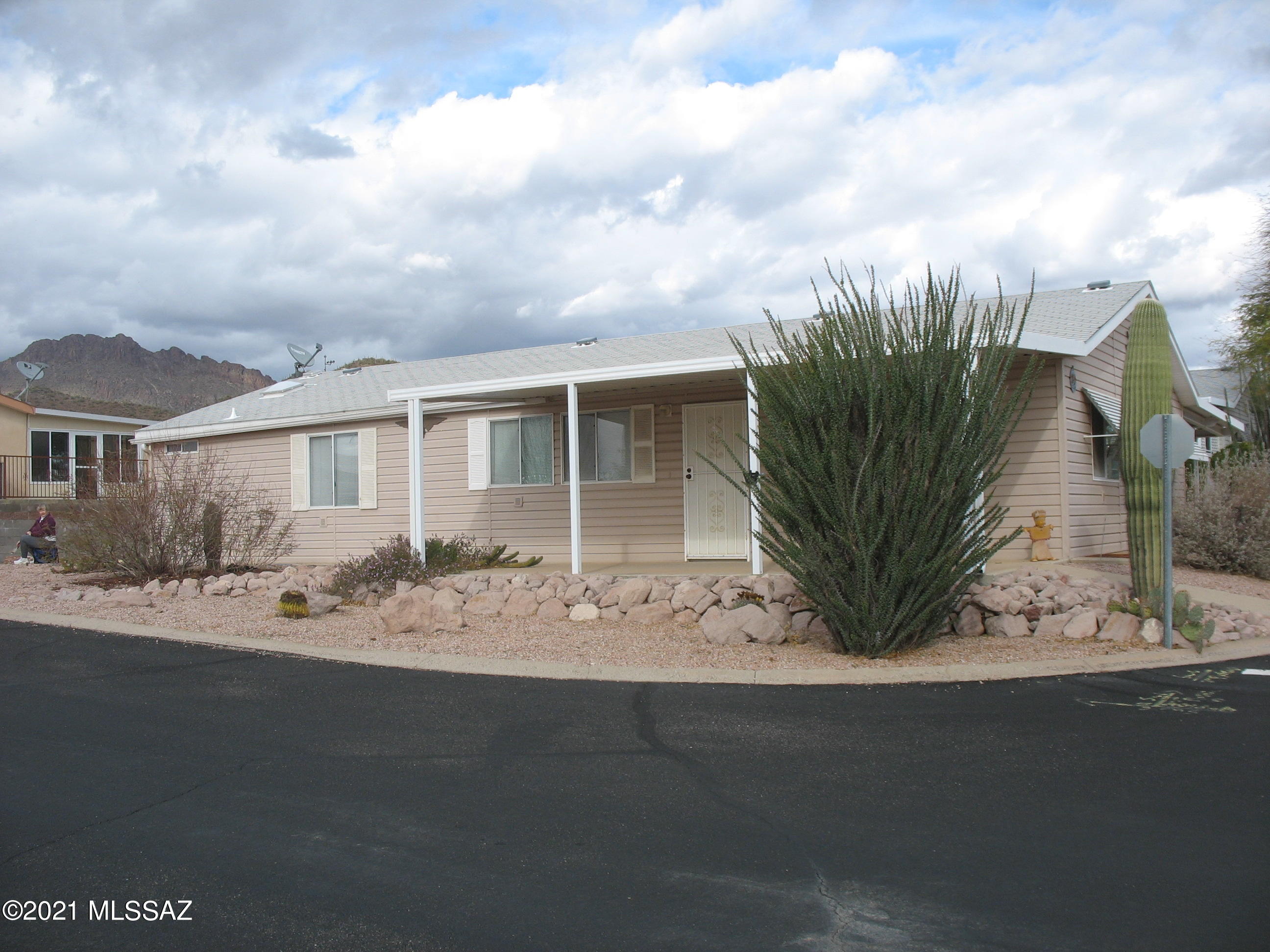 Nice 3 bedroom 2 bath home on corner lot!  Original owner.  Private patio in rear with mountain views.  Open living room to dining to large kitchen with island and breakfast nook.  Copper Crest is a gated 55+ Active Adult Community which includes swimming, spa, shuffleboard, pool table, work-out facility, hiking and biking, and more. And, all within a short distance of Tucson.  And you own the land!