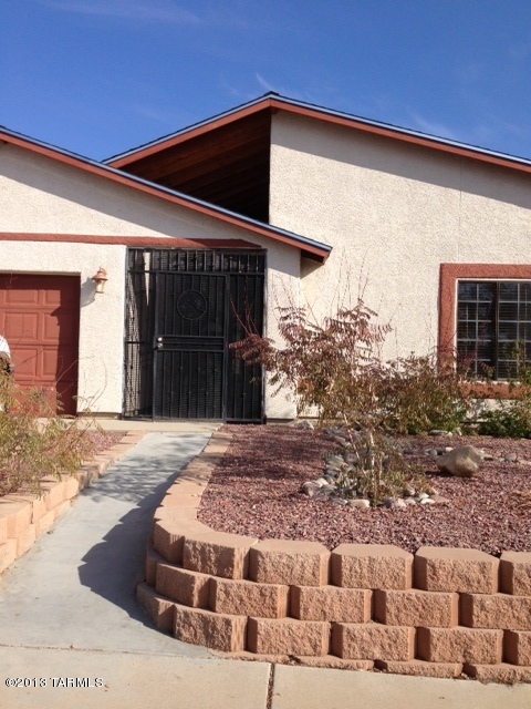 Fantastic home in great subdivision, this house has tile and wood thru out, huge huge kitchen with refrigerator, dishwasher, stove, washer/dryer hookup in laundry closet, large rear yard facing wash so very private no houses behind.  Large basketball court and vehicle gate on side of home, 2 car garage.