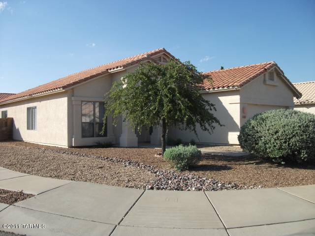 Delightful large home boasts 4 bedroom and 2 baths. Split floor plan with formal living/dining rooms, family room, eat in kitchen. All appliances. Extra storage. 2 car garage, cool A/C, nicely landscaped, covered patio, clean & ready to go!