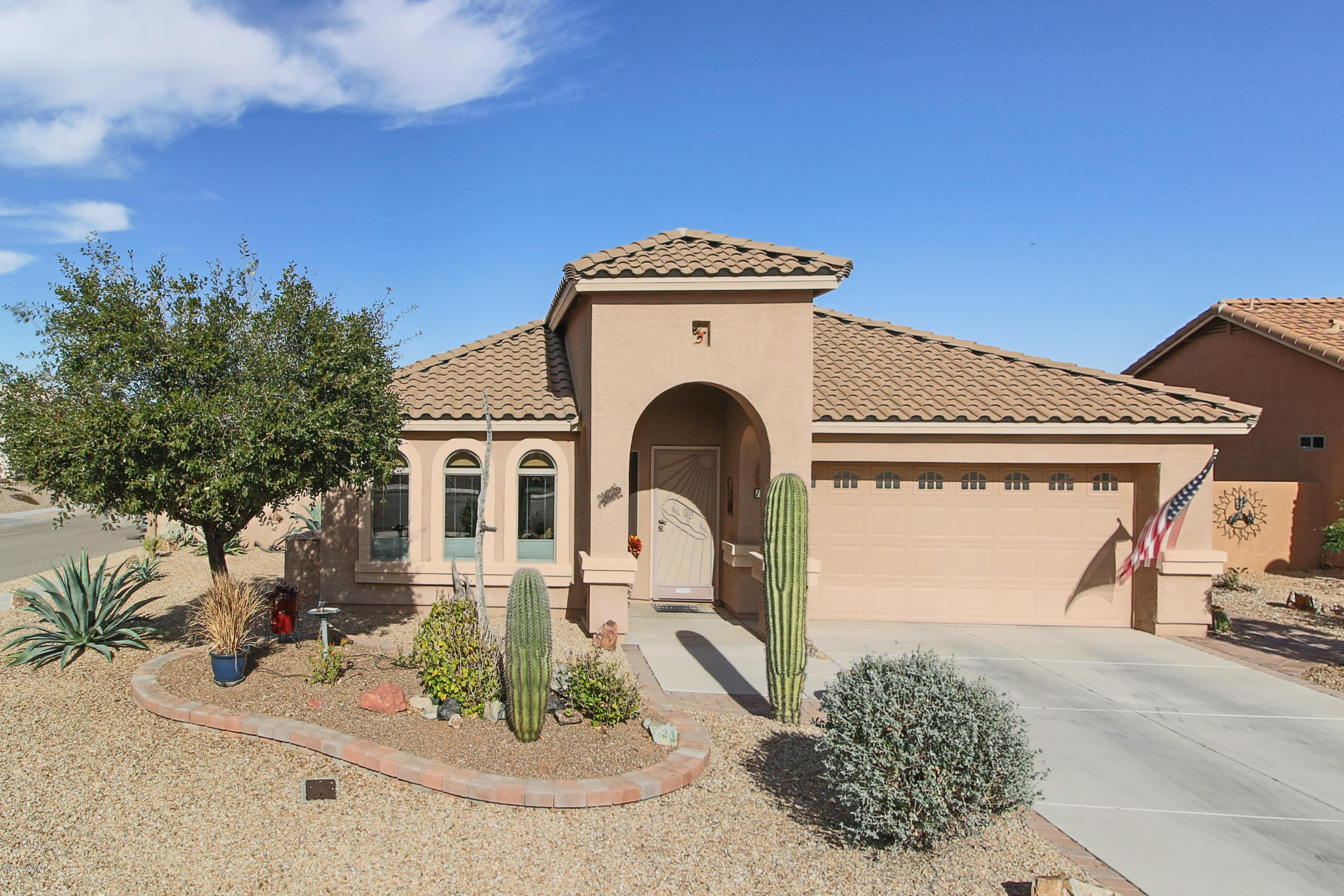 Beautiful DR Horton Mesquite Floor Plan with 4 Bedrooms located in Desert Creek Subdivision. Diagonal laid Tile, Hickory Cabinets throughout with custom made Hickory Window Cornices, 36'' upper Kitchen Cabs, Granite Countertops, Under Cabinet Lighting, Large Pantry, Reverse Osmosis, Water Softener, Exec Height Bathroom Vanities, R-38 Insulation in ceiling with Barrier System, R-13 Insulation in Exterior Garage Walls. Screened-in Arizona Room leads to a Charming Backyard with Fruit Trees. Enjoy the Gorgeous AZ Night Sky while sitting in the 6 seat Maxx Spa. Entertain guests on the Raised Patio with Views of the Santa Rita Mountains. This property is part of Green Valley Recreation (GVR). Located on the North side of Green Valley close to Shopping and quick access to Tucson.