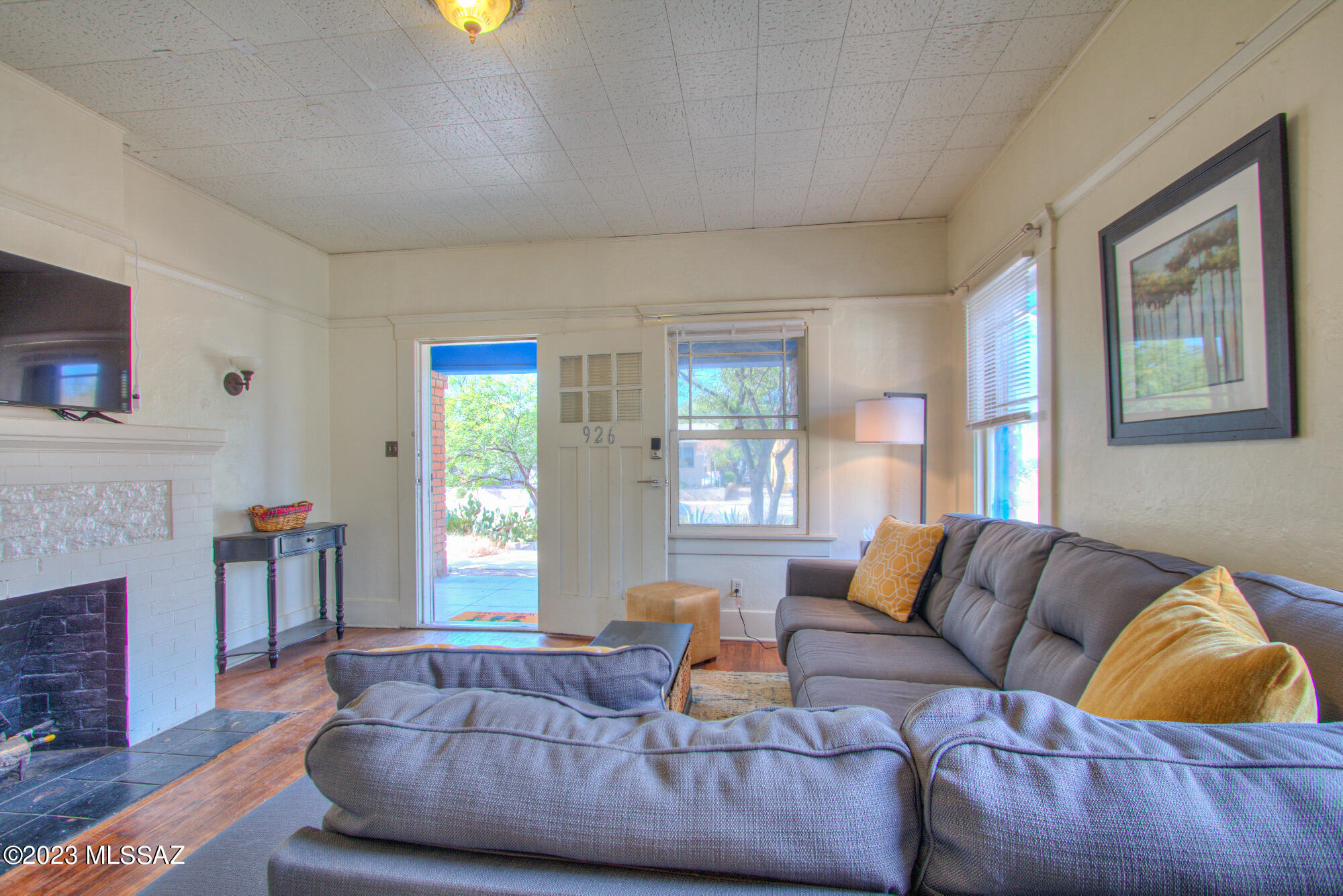 Available for short term (1 month) to long term (1 year) lease.  Rare gem fully furnished townhome in the Historic University District. Walking distance to the University of Arizona, 4th Ave and Downtown. This charming 1920's townhome has the original hardwood floors, two roomy bedrooms and a comfortable living space with a fireplace. Fully furnished! Off street parking 2 spots available. Water is included. Tenant pays electric & gas. Shared washer and dryer provided. Call or text David if you have any questions or if you would like to preview the home.