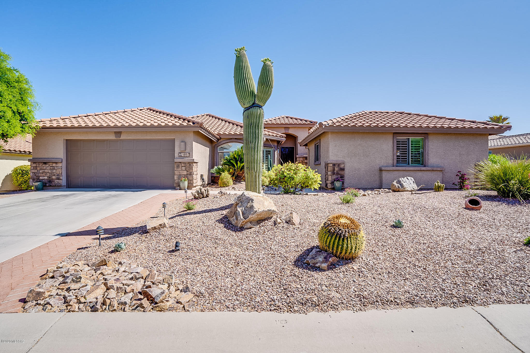MOVE-IN READY EXPANDED LAREDO W/CASITA! Enjoy the 2020 updates of master shower and fixtures, flooring and baseboards thruout. New paint in kitchen, master & garage, beautiful cactus water feature, new roof 2019, & many other upgrades. Private back patio with waterfall and gas fire pit that backs up to a natural common area with a peek of the mtns. Custom built casita is larger than most with bath & kitchenette. Other features include 2 ft extension along guest bedroom/office side, cozy gas fireplace, bay window, plantation shutters, & newer washer & dryer. Convenient to the clubhouse and amenities. Most furniture available by SBOS. Landmark home warranty offered.