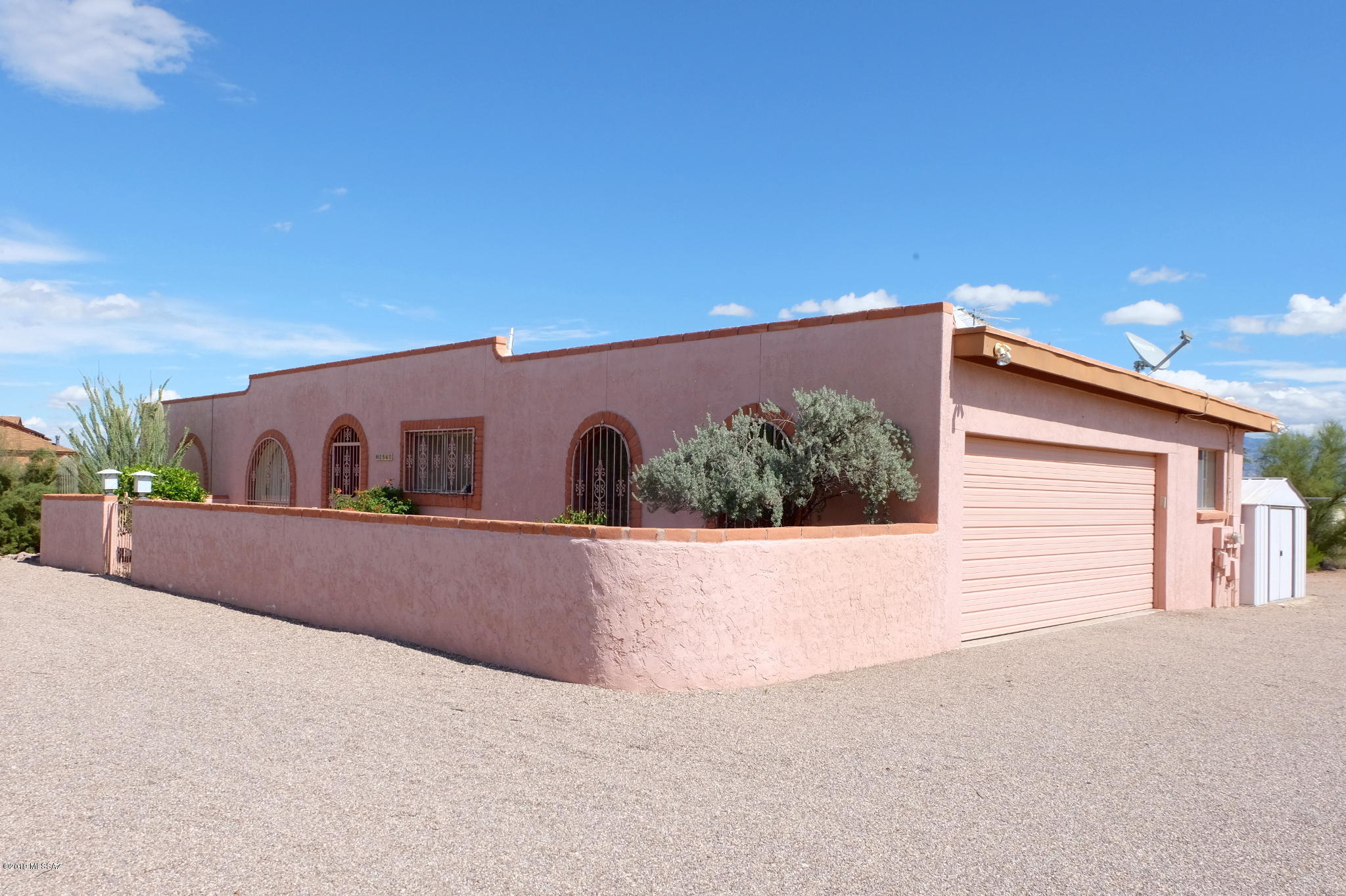 CR1 Zoning/Lot Size could allow up to 4 Horses. Enjoy Sonoran Desert living with views of the Catalinas and Tucson Mountains from this Territorial style 3 Bedroom/2 Bathroom home set on a private 1.13 acre (49,223sf) lot on the edge of Tucson's West side. Less traffic, less light pollution, and expansive undeveloped property across the road make this property the quiet getaway you're looking for. House is mostly original and has great bones to renovate to your liking, has air conditioning, and the private walled-in backyard could be home to a future pool. There's a 2 car garage, shipping container, and small shed for additional storage on the property and no HOA. All the benefits of rural life while being close to all Tucson has to offer.