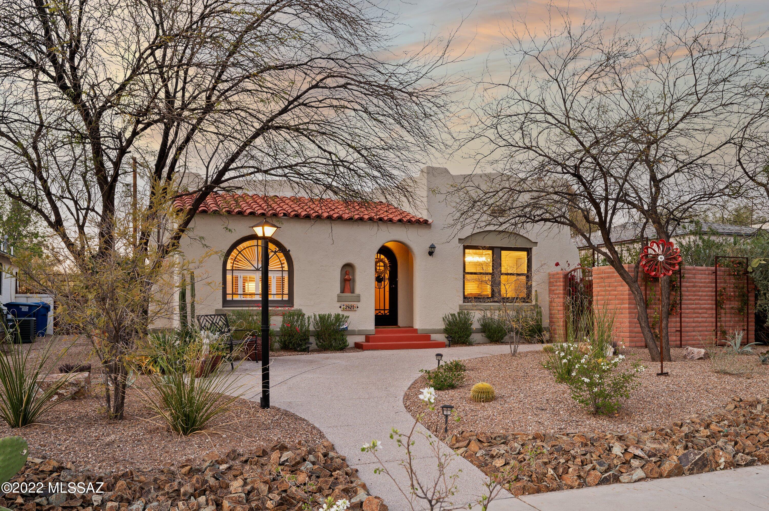 Charming 1936 four bedroom,  three bath home, complete with captivating guesthouse located in sought after Sam Hughes neighborhood. The 1451 sf main house has all the classic Sam Hughes touches you expect, hard wood floors, coved ceilings, combined with a thoughtfully remodeled & beautifully appointed kitchen, en suite master and separate laundry room. A wonderful steel-framed, covered porch/patio affords a comfortable, shaded outdoor space for entertaining & relaxing. Easy to maintain landscaping on auto irrigation system. The guesthouse is inviting w/ its exposed brick arches and easy access to its own separate outdoor space which is perfect as an Airbnb, rental or private space for visitors. Guesthouse also includes a separate washer/dryer. Close to everything!