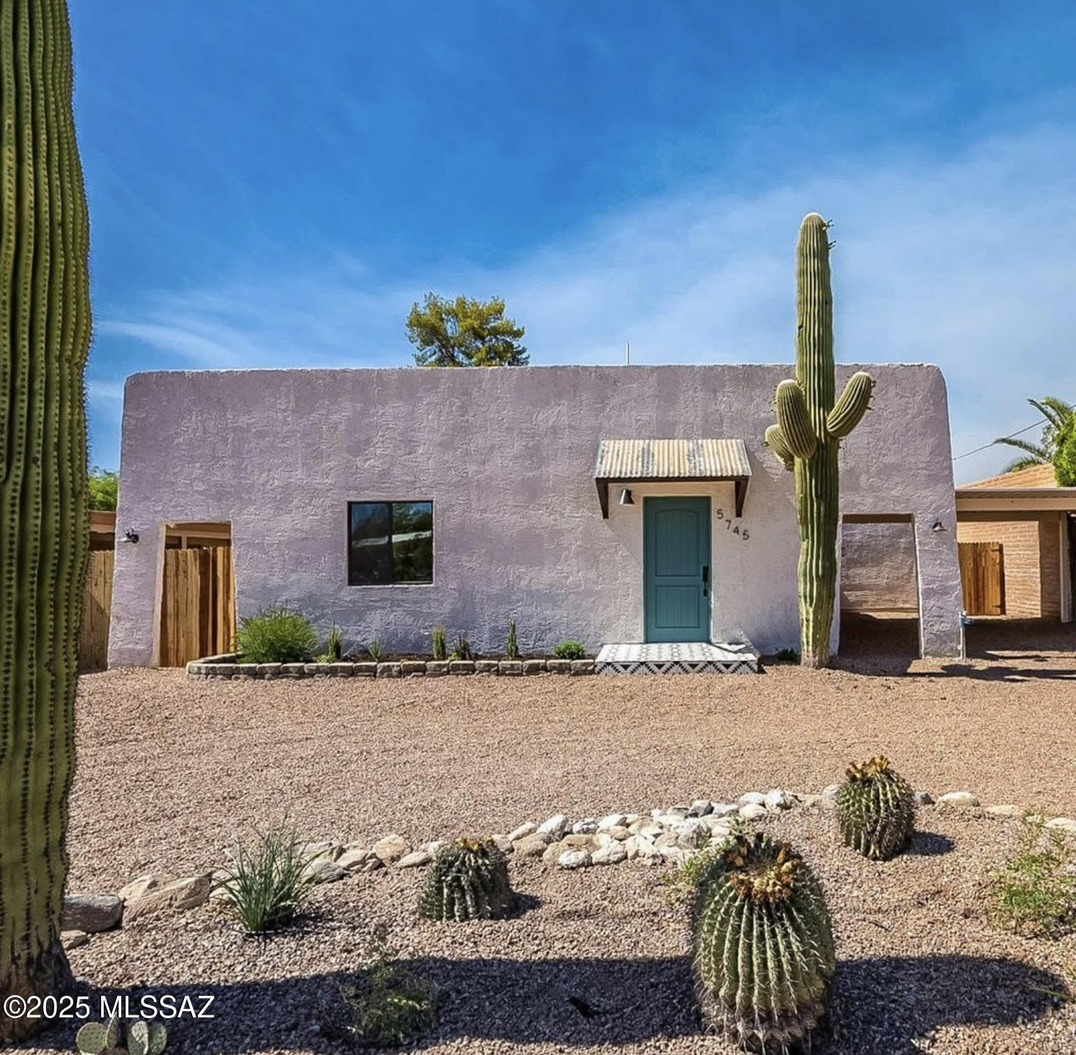 This 4 bedroom/2 bath home is full of charm and character! This updated home   has many features that include granite counter tops with a penny tile back splash  in the kitchen.  Plenty of counter space and pantry.  There is an alternative den/4th bedroom off the entry way.  The master bedroom has a walk-in closet, dual sinks & spacious shower.  The Family room off the kitchen is an ideal playroom/office with laundry closet.   Convenient to Tucson Medical Center, restaurants, and shopping.