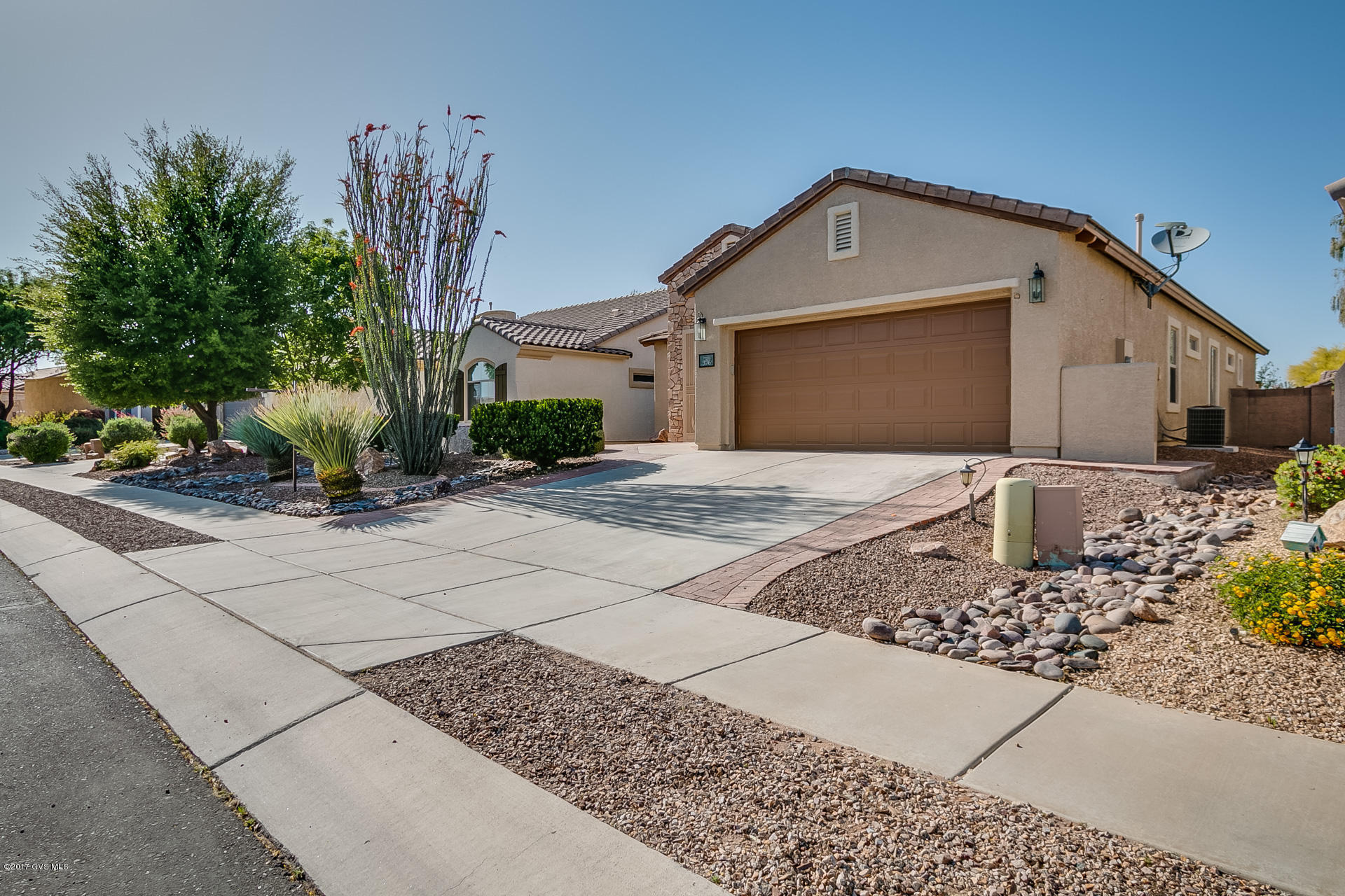 Fantastic Cortaro Model in Sonora by Del Webb, one of the largest models 1822 sq. ft., 2 BD/2BA with Den, Curbside you will see the appeal, mature landscaping, a front courtyard to chat with friends. The Custom security doors will guide you into the spacious LR/Dining Rm. The Comfortable Den is adjacent for privacy & quiet. There is a great room concept off the kitchen for easy entertaining. The kitchen Is complete with Pantry closet and eating space. The Master Suite is large and roomy bath with a walk in closet, shower, d.sinks (exec hgt), and a separate commode area. This is a split bedroom plan which is ideal for guests. A large backyard with extended paver patio. The entire interior an exterior was just painted, new carpet in bedrooms, new microwave in kitchen. Just move right  in! Ver Active 55+ Community with our very own Clubhouse, Pool, Fitness Center, Spa, Pickleball courts, Bocce ball, Horseshoes and tons of activities! you also have access to all the amenities of Rancho Sahuarita.