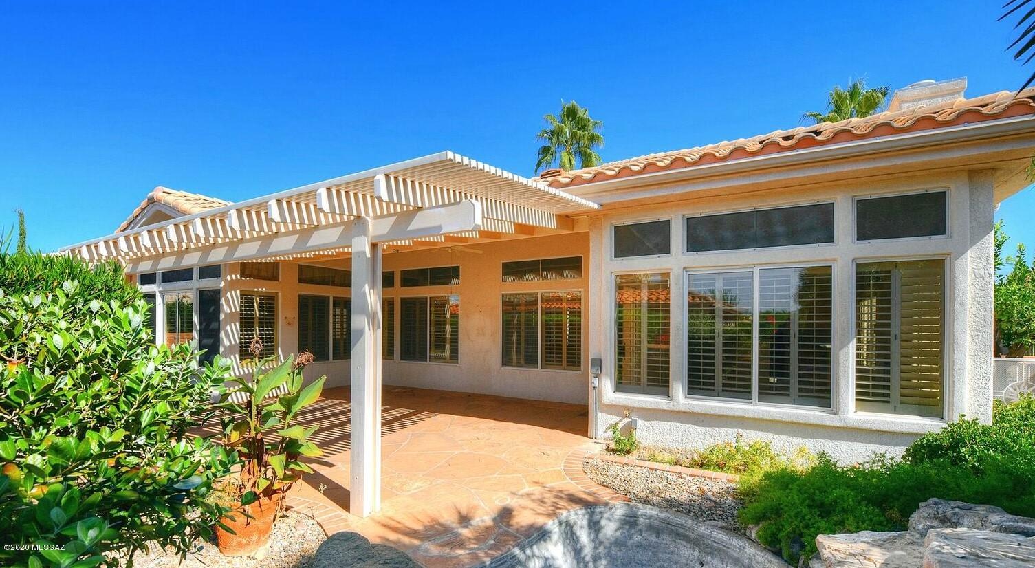Beautiful, Freshly Painted, Sunrise Model Home in Sun City. This Elegant 1,818 Sq. ft. home features a Bright Entryway, Open Living Room / Dining Room w/ wall of Windows looking out to the Tranquil Back Yard. Kitchen w/ Breakfast Bar is open to Family Room w/ Charming Gas Fireplace. French Doors open to your Large Master Suite complete w/ Walk-in Closet, Stand Up Shower, Soaking Tub & Dual Sinks. Your Back Yard Retreat is Pretty & Private with Covered Patio & Ramada .  Plantation Shutters Throughout your New Home. Also Featuring Laundry Room w/  sink + Great 2 Car Garage. This Wonderful Sun City Home won't last long! Sun City is a 45+ Active Adult Community w/ 2 Pools, 18 Hole Golf Course, Restaurant /Bar, Tennis, Pickelball & 100's of Clubs. Enjoy Life at it's Finest in Sun City!