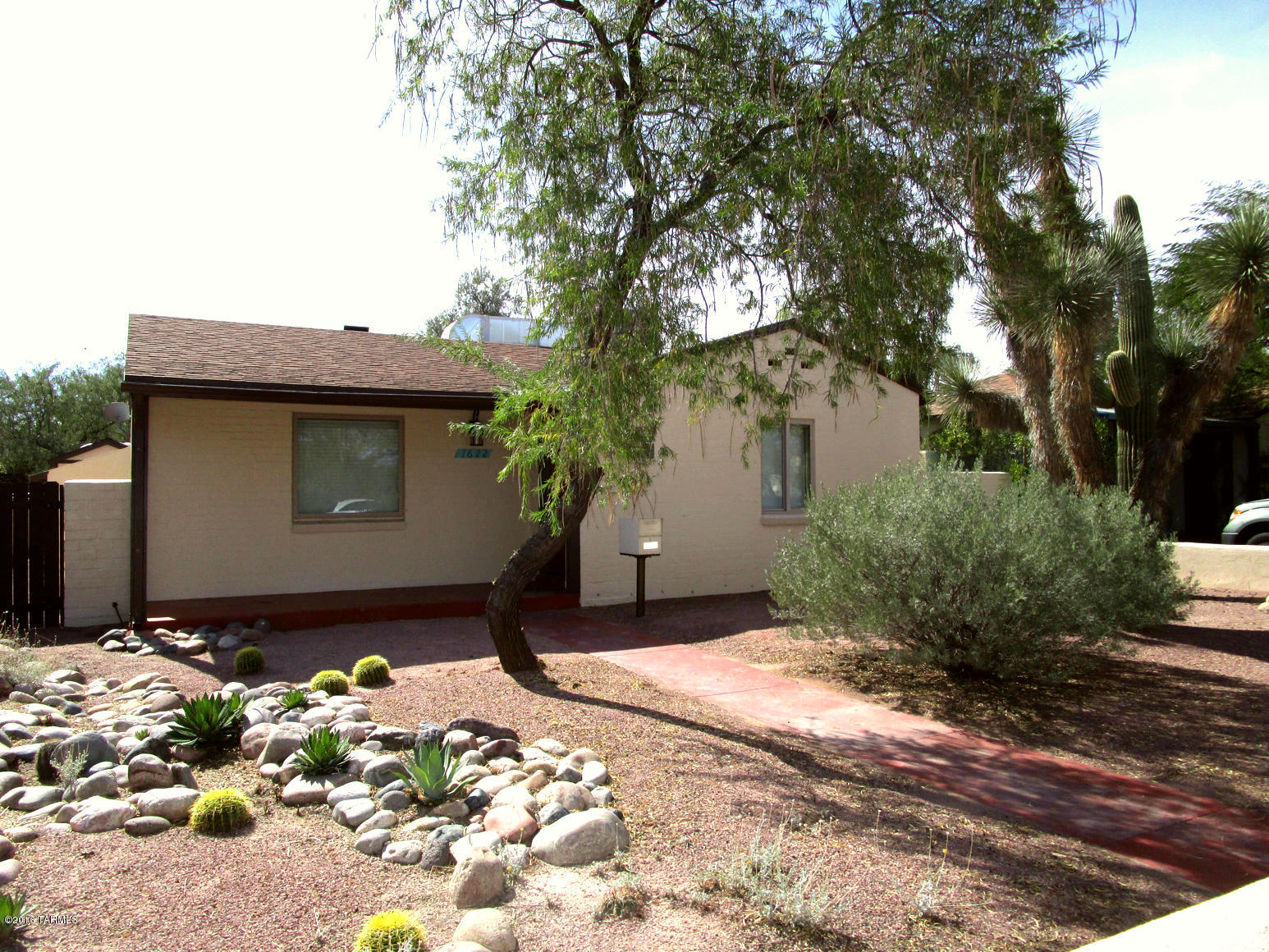Charming 2 Bedroom Home located in Historic Jefferson Park. Remodeled Kitchen with Granite. Tile Throughout. Living Room, Dining Room and Large Arizona Room. Large Walled-In Backyard with 2-Car Carport and Storage Shed. Includes Washer and Dryer. AC and Water Softener. Close to U of A, Shopping and Buslines.