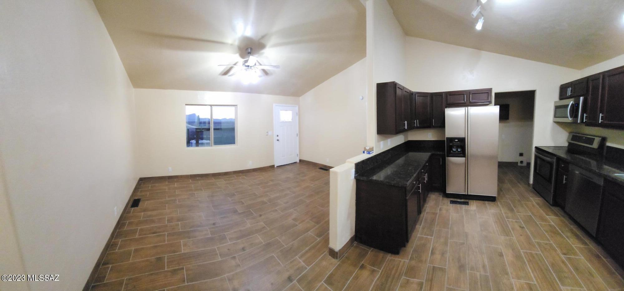 COMPLETELY REMODELED MANUFACTURED HOME WITH HOUSE GRADE PRODUCTS. Located on 1.28 acres with FANTASTIC PANORAMIC CITY AND MOUNTAIN VIEWS. Enjoy the gorgeous views and sunset from the front deck. Just east of the freeway off twin peaks with quick drive to downtown Tucson within 25 minutes. Fully sheet rocked taped and textured, one inch foam and fully stucco on exterior, all supply line plumbing replaced, all new dual pane low E windows, all new interior doors, new front and rear doors, all new tile, all new carpet, new granite counters in kitchen and master bath, all new plumbing and light fixtures and new bathtub and showers. Large building pad on the property for future building of garage, workshop, or house. All work was done under contractor's license.The owner is a licensed agent.