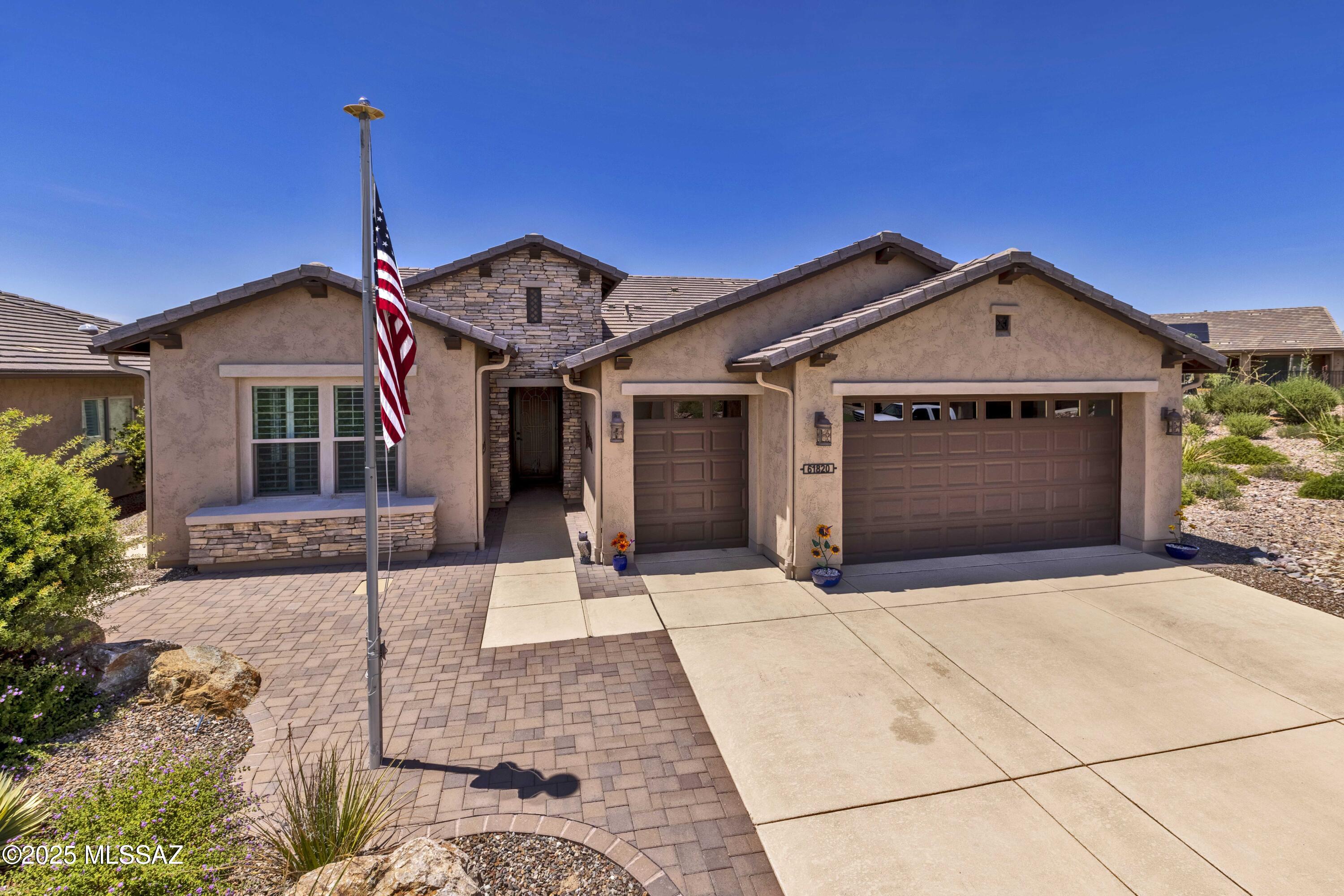 Newly painted interior! This Alora model home in Saddlebrooke Ranch is overloaded with add-ons and upgrades including a home audio system, central vacuum, and security system. And with a private back yard, it will be your perfect retreat or entertaining space. The focal point of the chef's kitchen is the large island with a waterfall quartz countertop. It also features a convection wall oven, gas cooktop, stainless vent hood, walk-in pantry, and tile backsplash - perfect for all your culinary adventures. The primary suite is practically its own wing of the house and has a curbless custom-tiled shower and a custom organizing system in the huge walk-in closet. The guest suite is on the opposite end of the home and is filled with light. It has its own bathroom with custom-tiled shower. The stunning powder room is accented with a full vanity and partially tiled walls with accent border tile. The expanded den/office with a door is the perfect place to work or relax in solitude. The rear covered patio features new rolling sun shades and extends onto a paved area, perfect for admiring the sunsets. Adjacent to green space, it provides ample privacy. The extended garage has a wall of sturdy shelving, a tankless water heater, utility sink, and space for two cars plus a golf cart. Expanded areas include primary bedroom/bath/closet, den, dining room, and guest bedroom. For discerning buyers seeking high-end living and the chance to enjoy all that Saddlebrooke Ranch has to offer, seize this gorgeous home before it's gone!