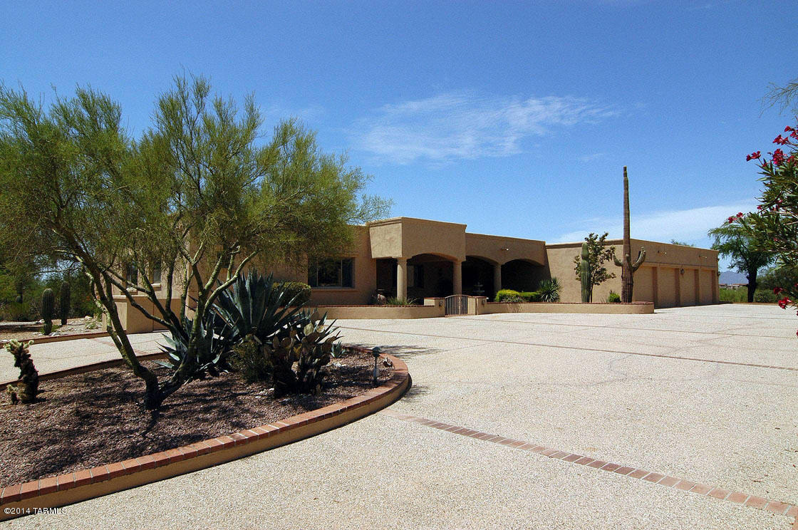 SHORT SALE, seller will consider all reasonable offers, SUBMIT OFFER! Magnificent Mediterranean perfect for a family in gated Catalina Foothills Estates 10, on prime lot that takes advantage of sweeping magnificent city views over the lap pool, spa and rose garden. Generous covered courtyard leads to a sky-lit entry that's a perfect showcase for art. Spacious open design flows gracefully from a main gallery to the cozy living room, gracious dining room, large family kitchen and spacious family room which includes a stunning bar area with wine storage and a rec. room with space for a pool table and more. Solid cherry cabinetry and stunning beamed ceiling features. Expansive covered porch overlooks lap pool and spa. And more...a four car garage! Close to downtown yet a million miles away. Second deed of trust has been paid off and we are only dealing with a first deed of trust. This is a simple short sale so don't be afraid of not closing on this beautiful home!! Submit your offer.