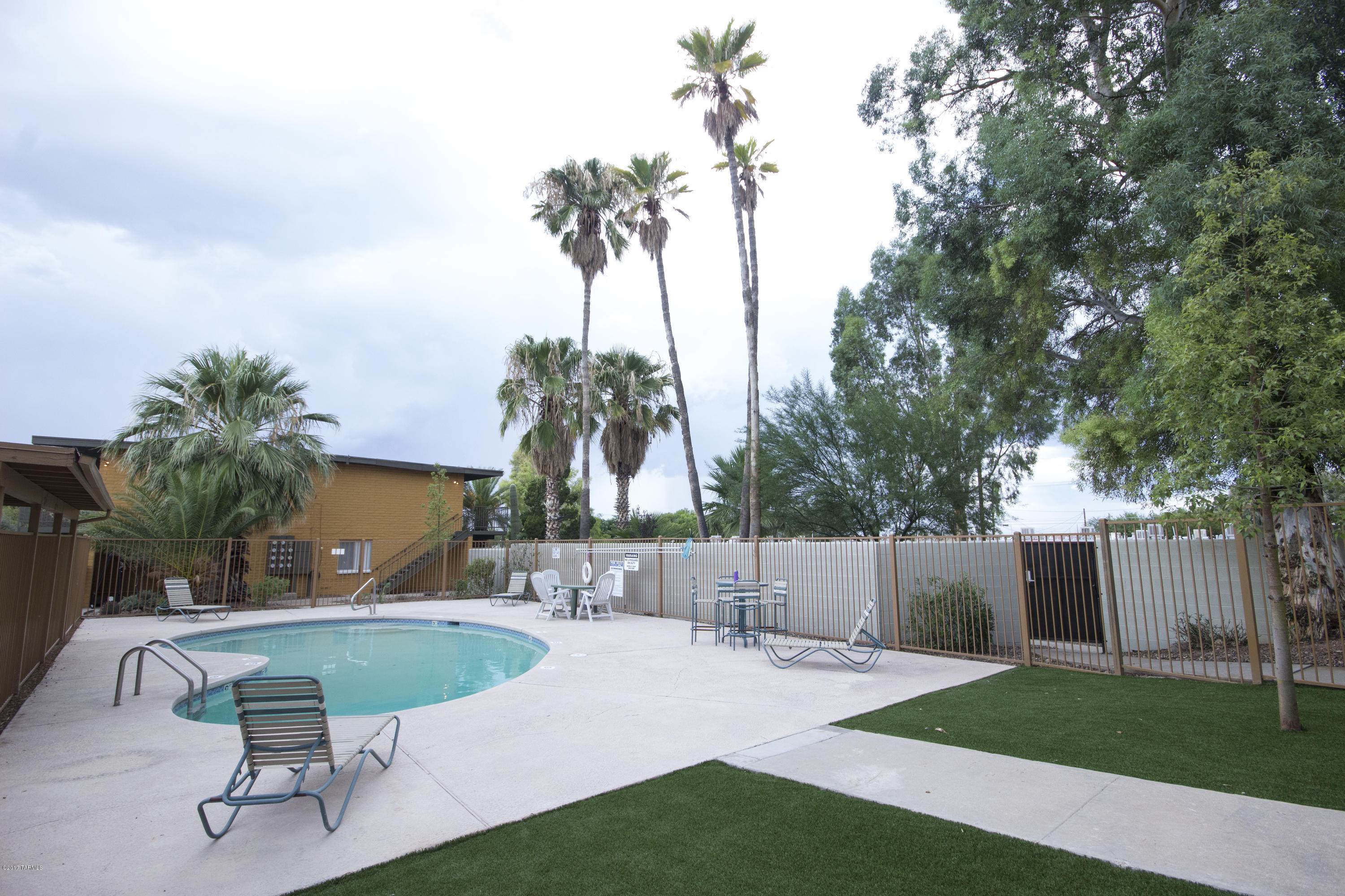 AMAZING OPPORTUNITY to own a Gorgeously remodeled (2016) 58 unit apartment complex less than 5 blocks to the University of Arizona. Fully leased through July 2018 (Yes, 2018!!). Each unit had new hardwood cabinets, granite counter tops, porcelain tile, paint, dishwasher, Microwave & electrical fixtures installed during 2016. New Clubhouse with leasing office and laundry room built in 2016. New block walls and metal gates installed 2016. Swimming pool, turf, and landscaping updated 2016. Complex built with concrete block exterior walls and concrete floors between units (except in bathrooms (plumbing). New Master Lease starting 8/1/2017. Numbers presented reflect new master lease. One of members of the Seller is AZ licensed broker.  Please do not go on the property or disturb tenants.