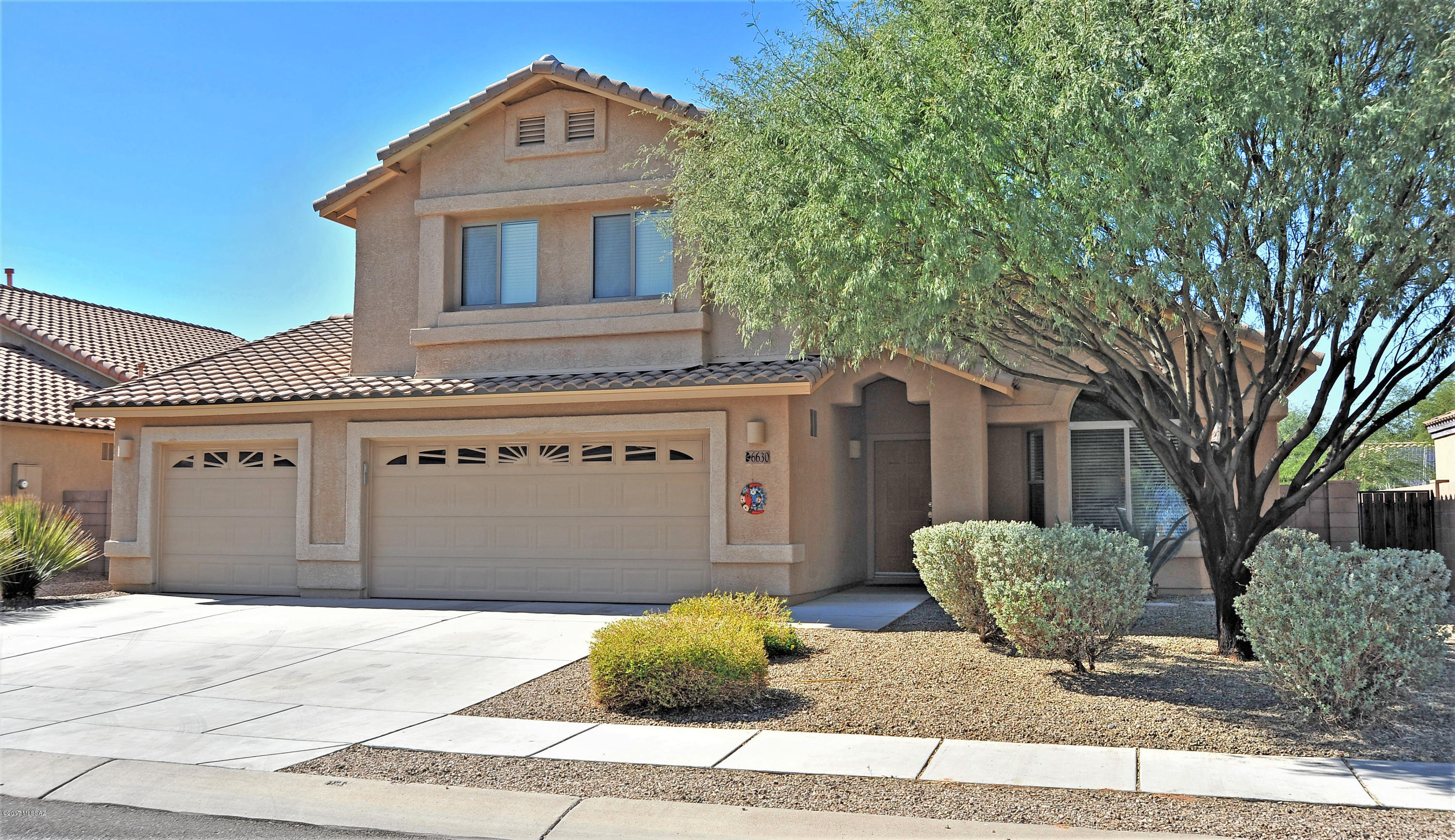 Sensational, Immaculate and Meticulously Maintained Home (Original Owners) Situated on A Beautifully Landscaped Premium Lot. It feels so Good to Walk thru this 5 Large Bedroom (One Bedroom/Full Bath are on Main Floor), 3 Full Bath Beauty that Offers Upgraded Fixtures/Lighting and Ceramic Tile in all Living Areas. Other Delights include a Formal Living Room and HUGE Great Room off Kitchen, Corian Counters in Kitchen and All Bathrooms, Recessed Lighting, Gas Stove, and Gas Furnace + Hot Water Heater. Outside is Just Lovely! Wide Streets with Sidewalks, and a Larger Lot than Most begins to describe this Cozy Neighborhood. The Backyard feels like a Desert Oasis Offering Privacy, Grapefruit, Lemon, Lime, Mandarin + Naval Orange Trees. Also...Perfect for Entertaining!!! A Pleasure to Show.