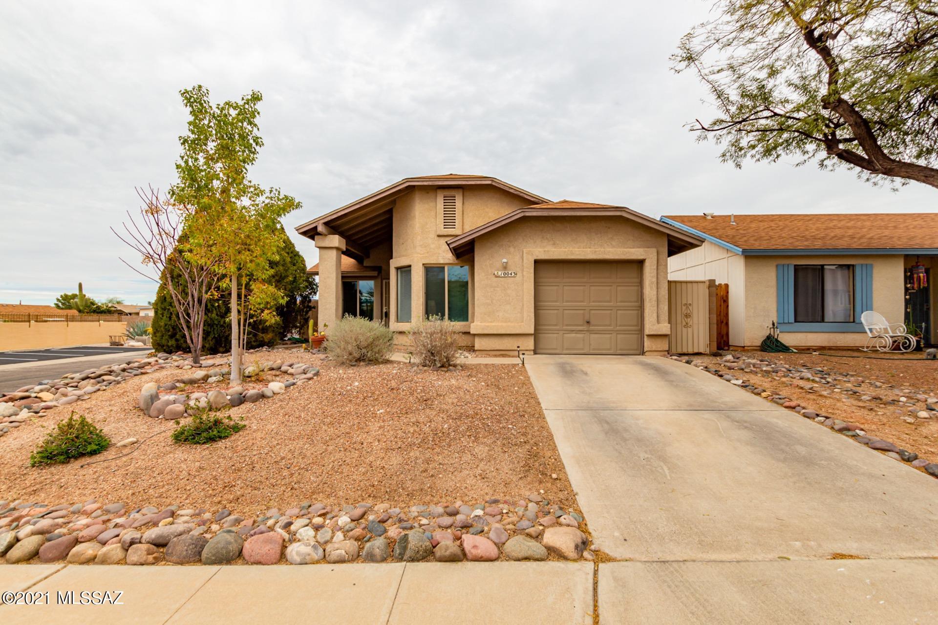 Range priced $185,000 - $190,000. Fantastic home nestled on a corner lot w/great curb appeal. Beautiful tile floors throughout, vaulted ceilings, soothing palette, plant shelves, ceiling fans, & fireplace in the family room.  Neutral tile floor in kitchen, plenty of wood trimmed cabinets, tile counters/backsplash, & dining area in family room. Generous size bedrooms, ample closets, 2 baths, 2 window seats, & laundry area in garage. Charming backyard w/a covered patio & desert plants. Take a tour today & stop renting!