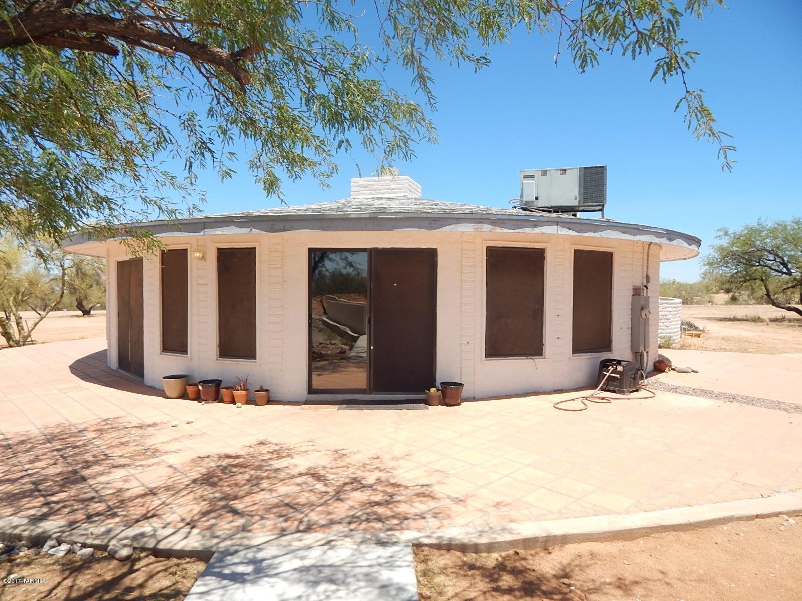 PRICE JUST REDUCED! Well maintained home on more the 1 acre lot! move in ready! With 1257 sq ft of living space this home has 1 bedroom, 1 bathroom, in the main house and 1 bedroom, 1 bathroom in the pool house. 4 door, 4 car garage & large backyard with pool great for entertaining. <FONT COLOR=RED> This home is a must see! </FONT> Refigerator is included in AS/IS condition. Located in Southwest Tucson.