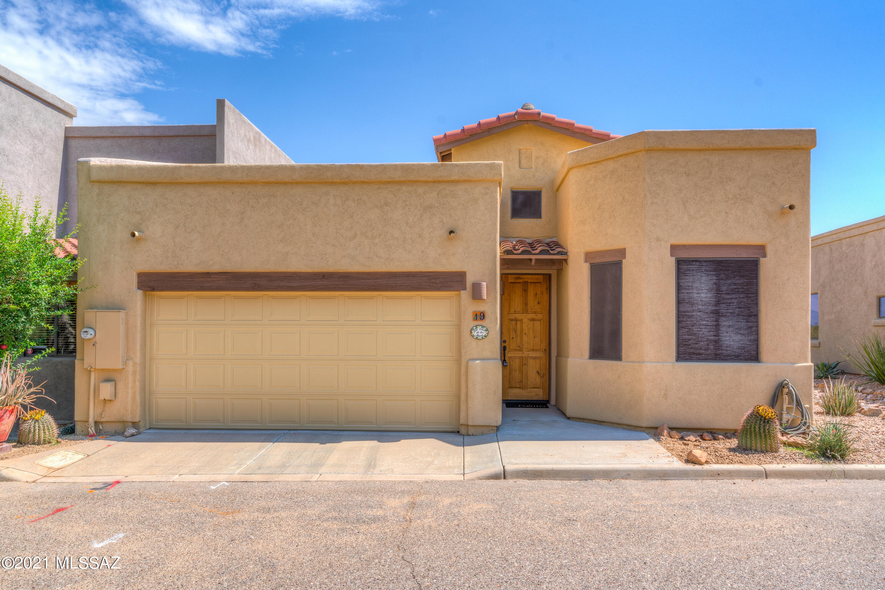 Beautiful 2 bedroom, 2 full bathroom Townhouse in Corona De Tucson. This lovingly cared for home backs up to vacant land and has vast views of the mountains. This home has vaulted ceiling and lots of natural light.  The kitchen comes with all the appliances including stainless steel refrigerator. There are granite countertops and extra seating at the island bar. The master suite has dual sinks, a large shower and walk-in closet. Enjoy sunrises on your private enclosed patio and keep your cars out of the sun in the 2 car garage. This home comes fully furnished and includes all appliances. All you need to do is bring your suitcase and move right in.