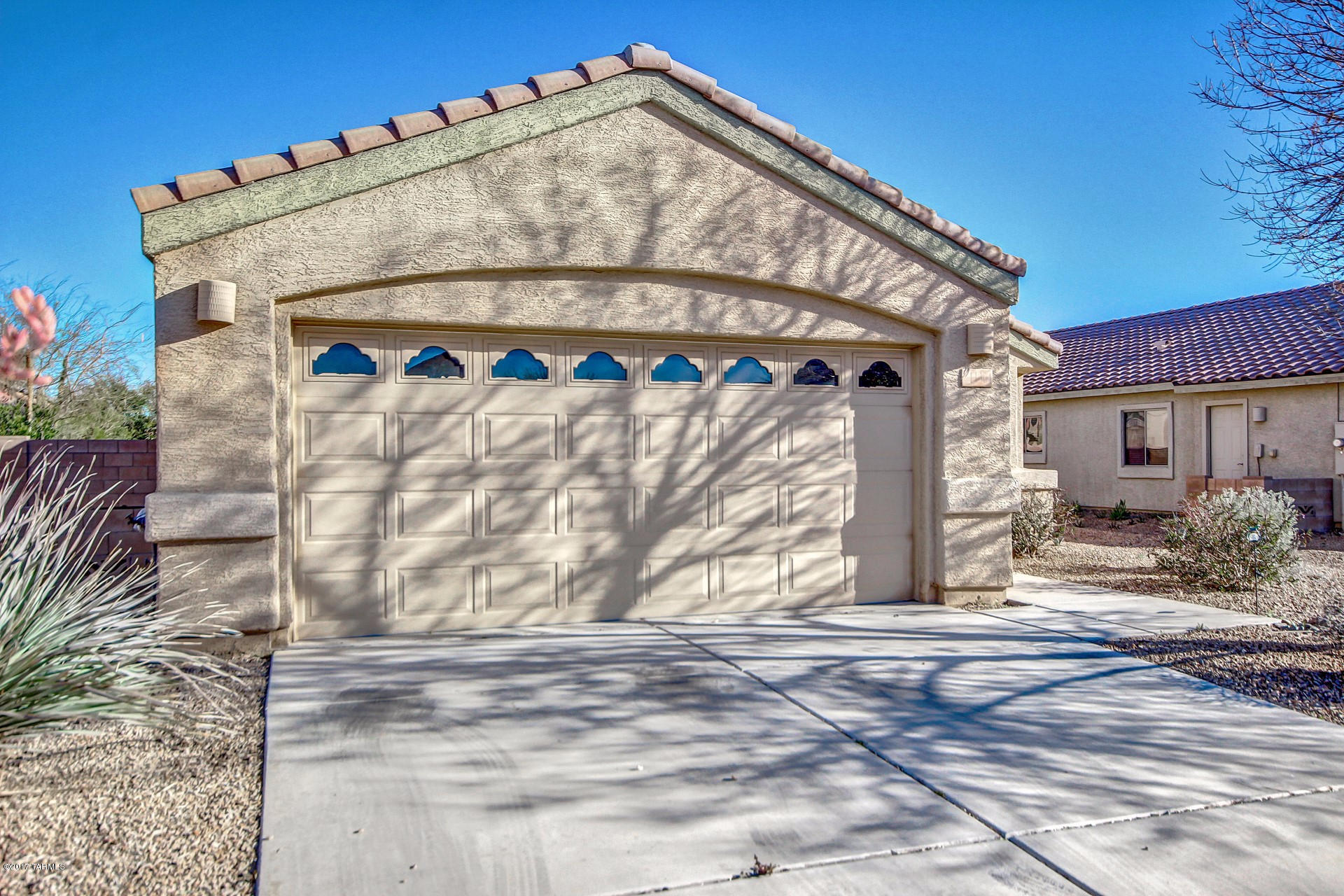 Fantastic single level Home with 3 bedrooms, 2 baths, and 1412 sq ft. Soaring ceilings, soothing interior palette, ceiling fans, plush neutral carpet, upgraded lighting, and spacious great room floor plan. Patio access from dining area. Stunning eat-in kitchen features breakfast bar, stylish counters, SS/black appliances, pantry, tile floor and wood cabinetry with hardware. Perfect Home for entertaining inside and out. Interior laundry room. Generous size bedrooms, plenty of closets, and move-in ready Home. Peaceful & serene backyard boasts covered patio, meticulous desert landscape, and endless blue skies. Will NOT disappoint!