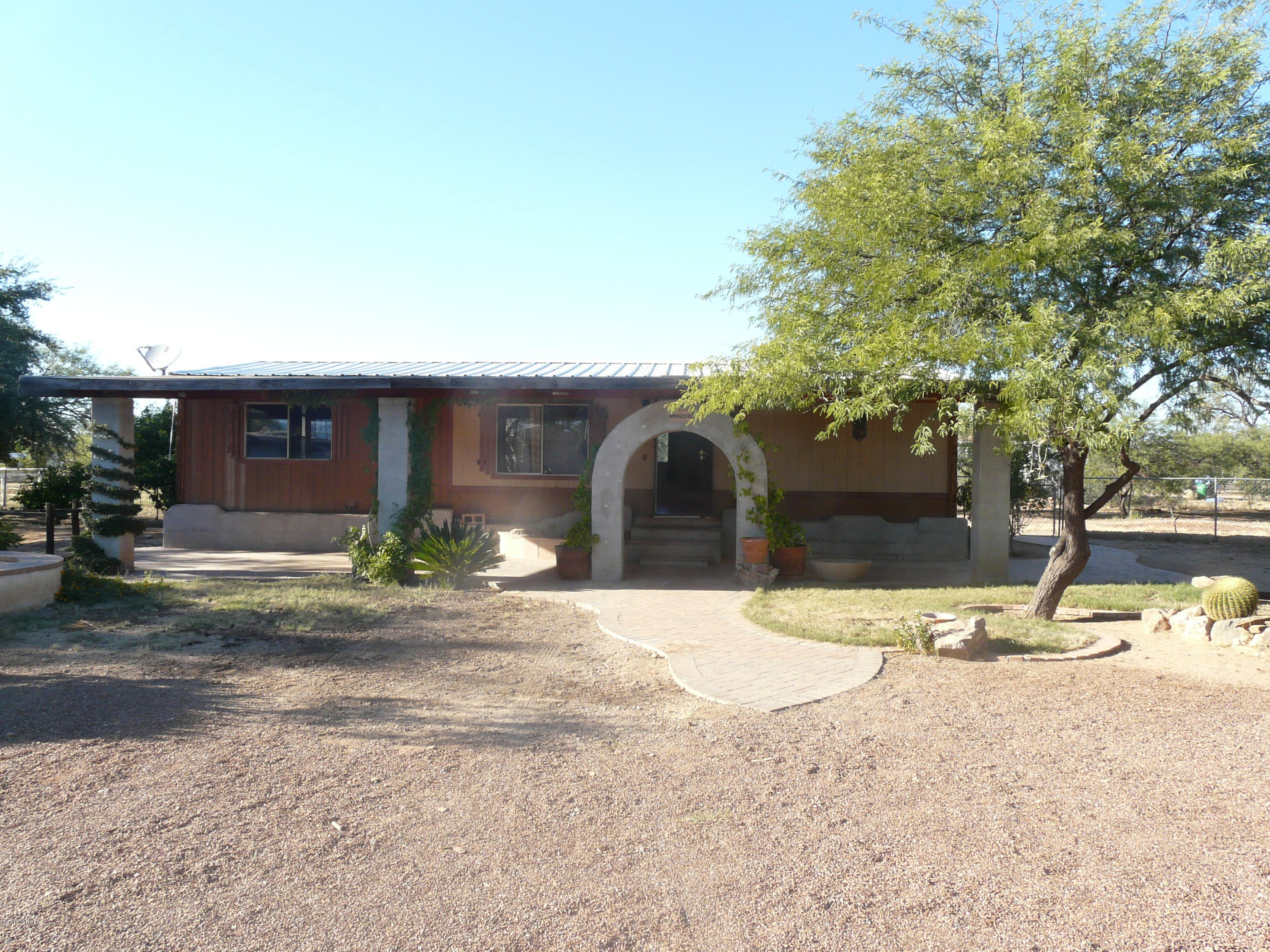 Fantastic place to call home. This manufactured home is affixed and is on over an acre in beautiful Sahuarita. This property has beautiful tall trees, fruit trees and nice sitting areas. Main house is an open 3 bedroom 2 bath home (1152 Square feet) and has a large kitchen and family room. Included in the sale is a single wide trailer with 2 bedrooms (1008 square feet),it is affixed but needs repair.Can be fixed up to be a great storage or more living possibility. The spa also conveys but is as is. Go see today.