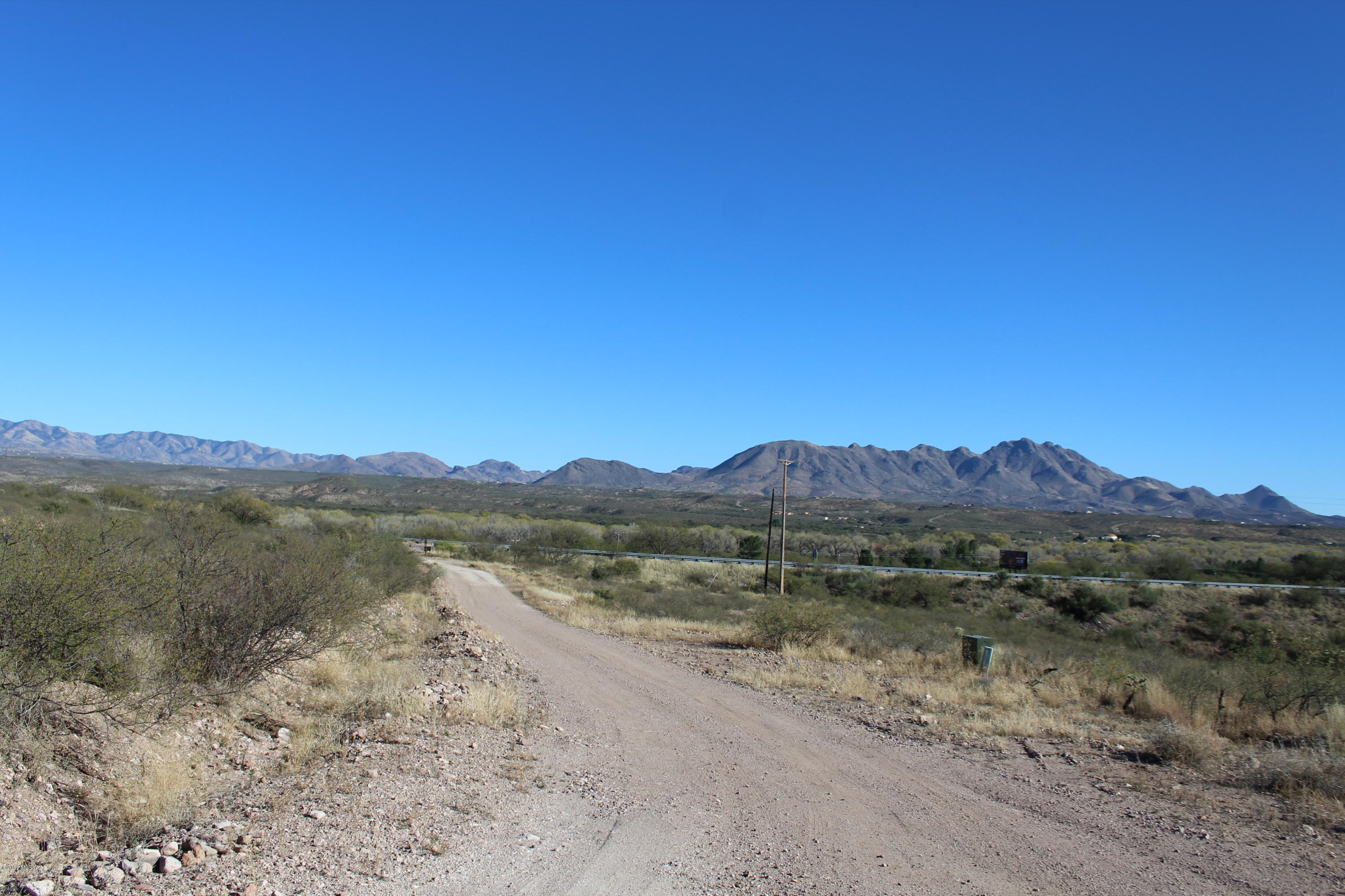 View, Views and more Views!  This 20 acre parcel situated in a gated area allows you to pick which mountain range you want for your new homes primary view, the Santa Rita's, Tumacacori's, San Cayetanos, or all of them?  Rolling hills but plenty of flat plateaus to build your dream home. This property is located right off the west frontage road to I-19 south of the Tubac exit. This frontage road does not connect further south so this property has the benefit or paved ADOT access without the traffic.  The property is connected to a community well and is ready to go!!