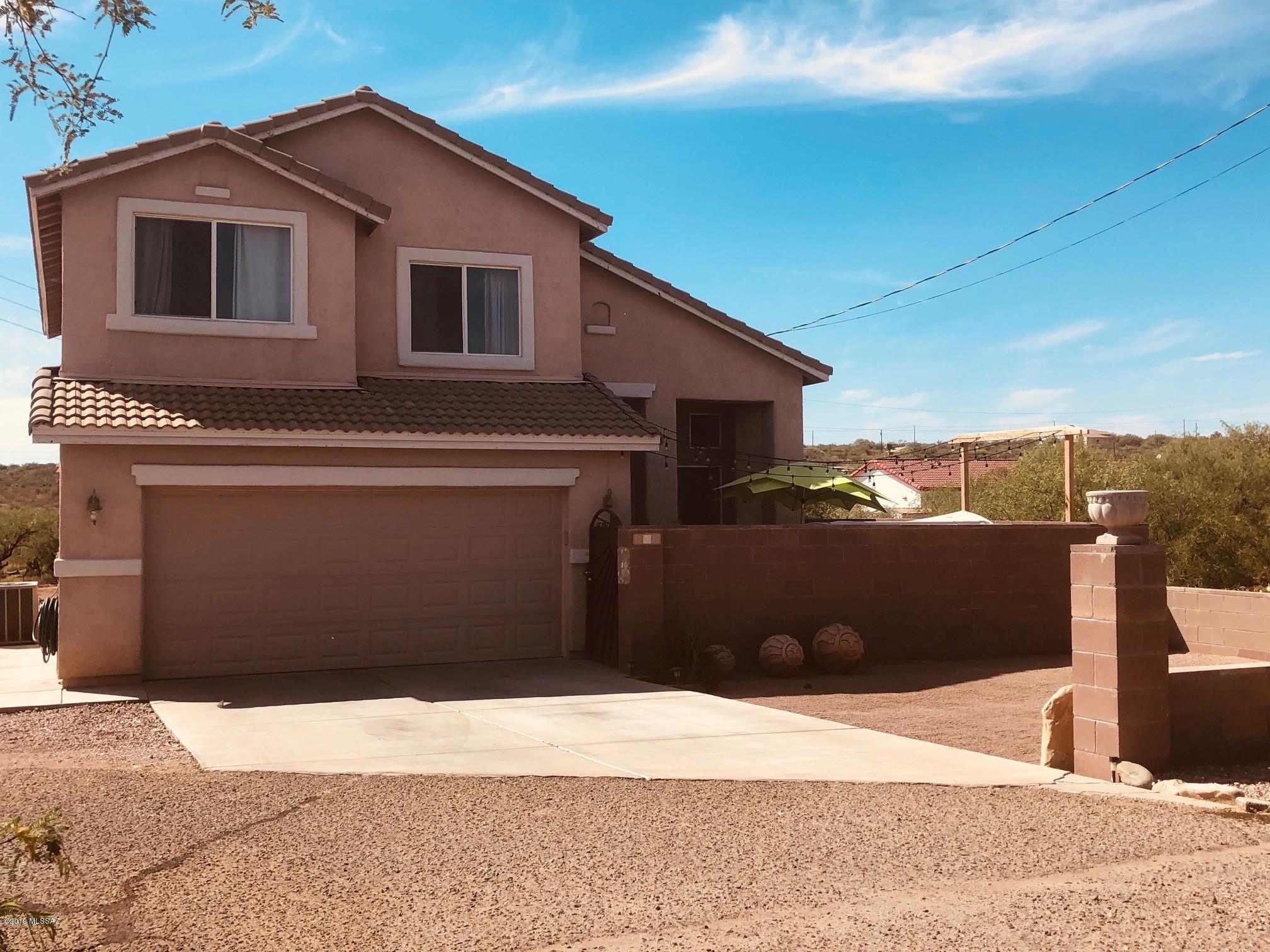 Very loved and well taken care of 4bd/2.5ba,  2 Story home sitting on a quiet cul-de-sac with a quarter acre.  Views of many mountain peaks around. No HOA. Rural living but only 15 mins to Rio Rico or 25 mins to Nogales shopping. A great starter family home. Short walking distance to bus stop for SCVUSD.
Lots of potential for backyard and side of house to place your personal touches. Cleared and cleaned. This is a must see home. Motivated Sellers.