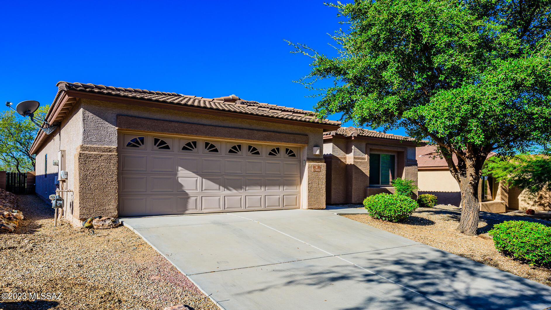 Vail School District!  Community Pool! This 1776 SF impeccably maintained home features 3 Beds/2 Baths!  Great Room with gas fireplace!  Split Floor Plan!  18-inch tile throughout with carpet in bedrooms only!  Neutral Paint! Large kitchen features island, Corian countertops, upgraded cabinets!  Primary bedroom/bath features 2 walk in closets, garden tub, and dual sinks!  Bedroom 2 tiled with closet and double doors...could be used as an office/den as well!  Private tranquil backyard features extended patio, turf, mature trees, and breathtaking MOUNTAIN and SUNSET views!