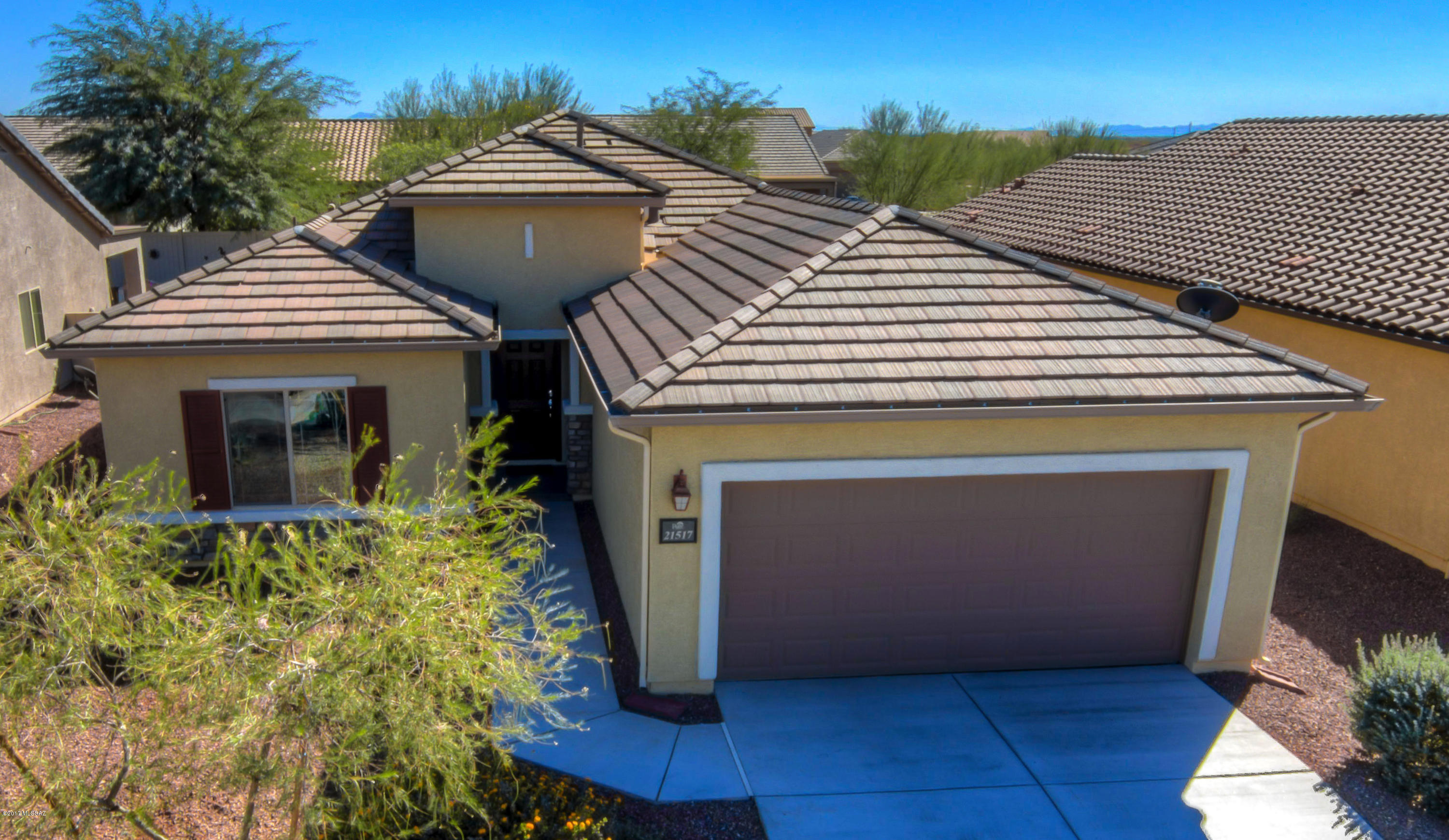 If you are thinking new, see this home first. Perfect condition due to professional cleaning on a weekly basis - the cleanest home in Red Rock. Shows like a spec home with black granite countertops, staggered height cabinets with crown molding, designer tile flooring, and an extended covered patio. All without the new construction premium price, construction 3-5 month wait time, or the months of neighboring construction. New construction feel without new construction drawbacks. It is better than new. Community includes a private water park, hiking trails, sport court & a skate park. Brand new playground built for entire community! Perfect community for all!