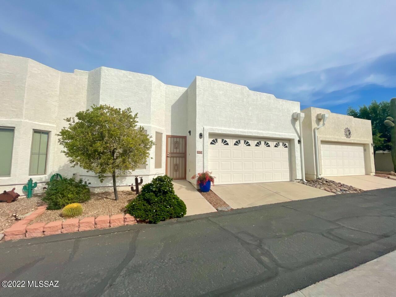 This large and very well maintained townhome is located in a gated 55 and up community with a pool and spa. This 2 bedroom and 2 bath home offers an airy open floor plan with tons of natural light throughout.  Home features several skylights. Each bedroom is generously sized and with plenty of closet space in both rooms. Master bathroom has a walk-in shower.  Enjoy your patio that is accessible from the master bedroom. Kitchen has  a large pantry and has a newer dishwasher.  There is great storage space with its attached 2 car garage.  This home is perfect for a full time resident or a snow bird. Come check out this home in the popular Sierra Villas community!
