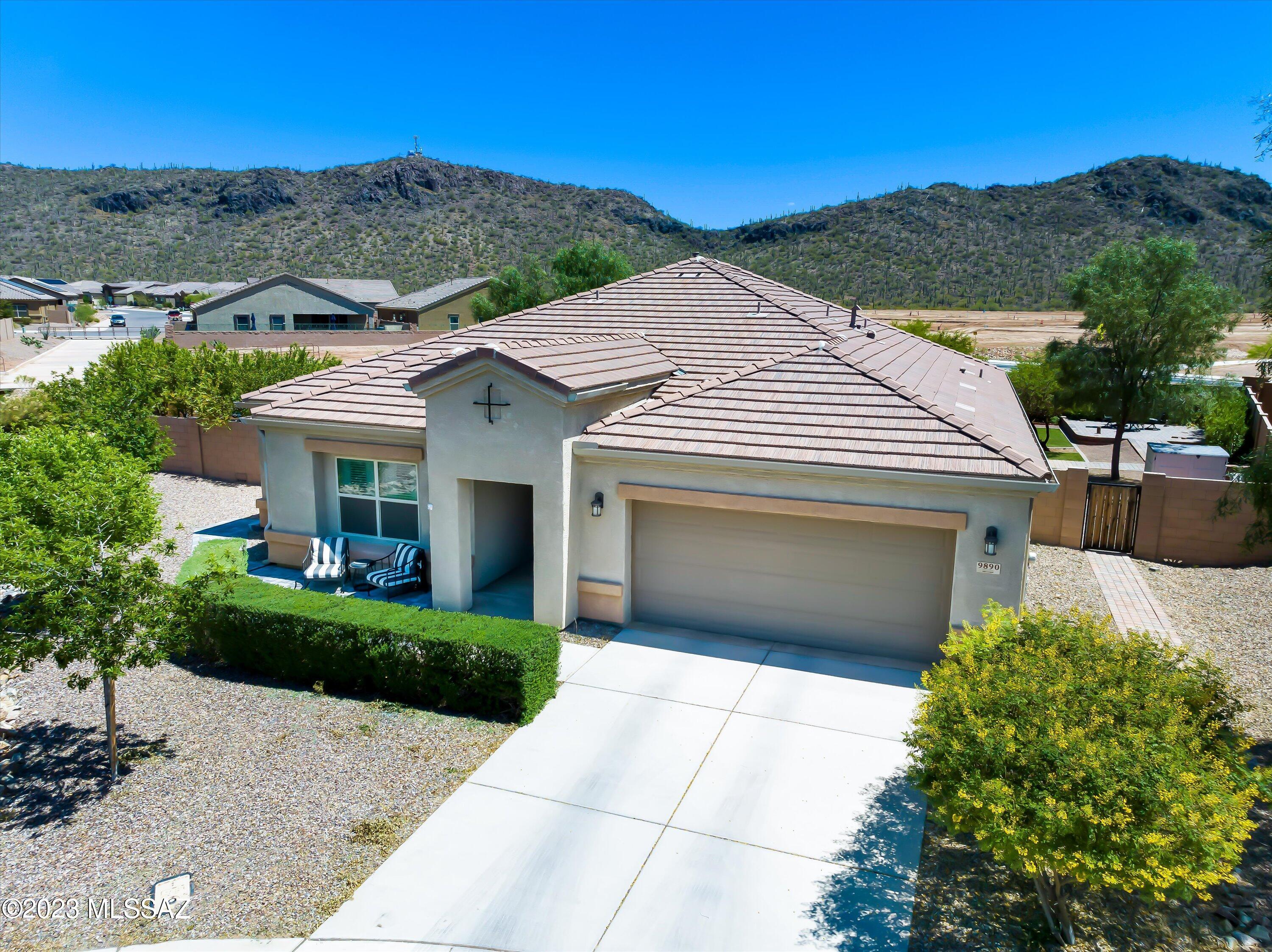 Come see the largest lot in Saguaro Springs. This home has been lovingly cared for by original owner. Well appointed kitchen with granite counters, large island and plenty of room for entertaining. Wide doors for wheelchair access, and all tile floors throughout. This home is truly move in ready as owner is willing to leave most furniture in separate bill of sale. All appliances stay and make this home a turn key opportunity! With 2 large bedrooms, and a private den area for an office, or guest space, this home is the largest floor plan offered in the community. Gated entry and no neighbors behind the home for a striking private yard. The large covered patio is East facing with ample shade, and several patios offer private spaces of relaxation. Room for pool, spa or other additions!