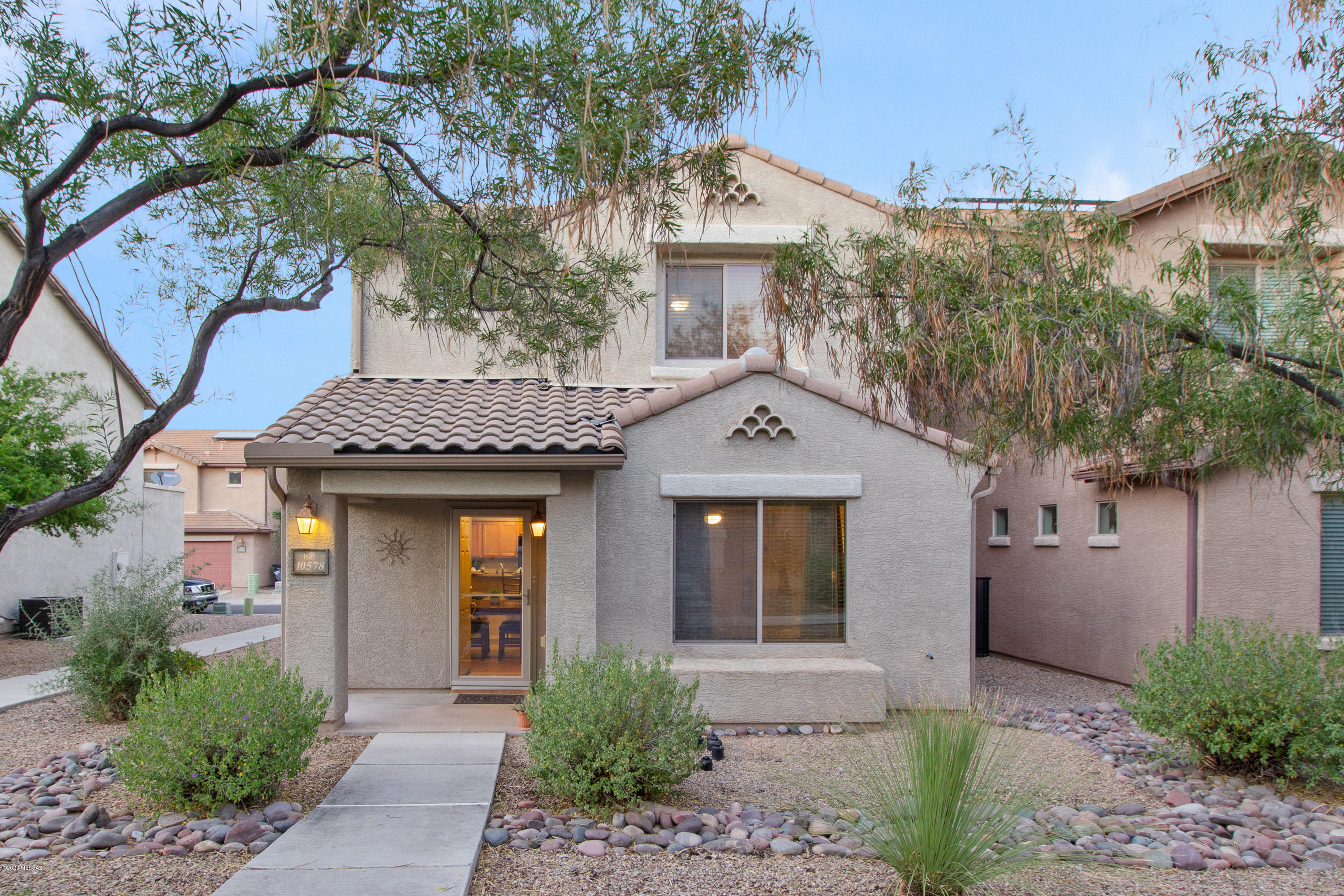 Range priced from $215-$220K. This well-loved 1479 SF end unit courtyard home features 3 bedrooms, 2.5 bathrooms, tile downstairs and in bathrooms, gorgeous wood-look laminate up the stairs and into the bedrooms, surround sound throughout, custom paint, and more. Full glass safety door allows light in, without sacrificing security. Enjoy all the community amenities Sierra Morado has to offer, including schools within the Vail School District. Come. See. Stay!