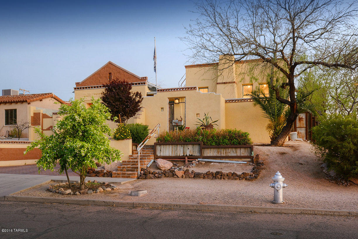 LOCATED IN THE HIGHLY SOUGHT AFTER SAM HUGHES NEIGHBORHOOD, THIS ONE OF A KIND HOME BY RENOWNED ARTIST/BUILDER DAVID TAGGETT, IS CONSTRUCTED OF MASSIVE 16'' THICK MASONRY WALLS, PROVIDING THERMAL PROPERTIES, STORING COOLING & HEATING DEPENDING ON THE TIME OF YEAR. ENTER THROUGH THE FRONT ANTIQUE GATES, INTO A HOME DESIGNED AROUND A CENTRAL COURTYARD, W/ THE PRIMARY STRUCTURE BEING COMPRISED OF A GREAT-ROOM, KITCHEN/DINING, MASTER SUITE, POWER ROOM & LAUNDRY ROOM, JUST OFF THE 2 CAR GARAGE. EACH OF THE SPACIOUS SECONDARY BDRMS (W/ FULL BATH) ARE ACCESSED OFF THE CENTRAL CRTYRD, LEADING TO A PRIVATE REAR PATIO, W/ BUILT IN FIREPLACE, BBQ & WATER FEATURE. WALK TO NEARBY RINCON MARKET & RESTAURANTS, CLOSE TO THE 3RD ST BIKE ROUTE, HIMMEL PARK & 5 BLOCKS FROM THE UNIVERSITY. A MUST SEE HOME!