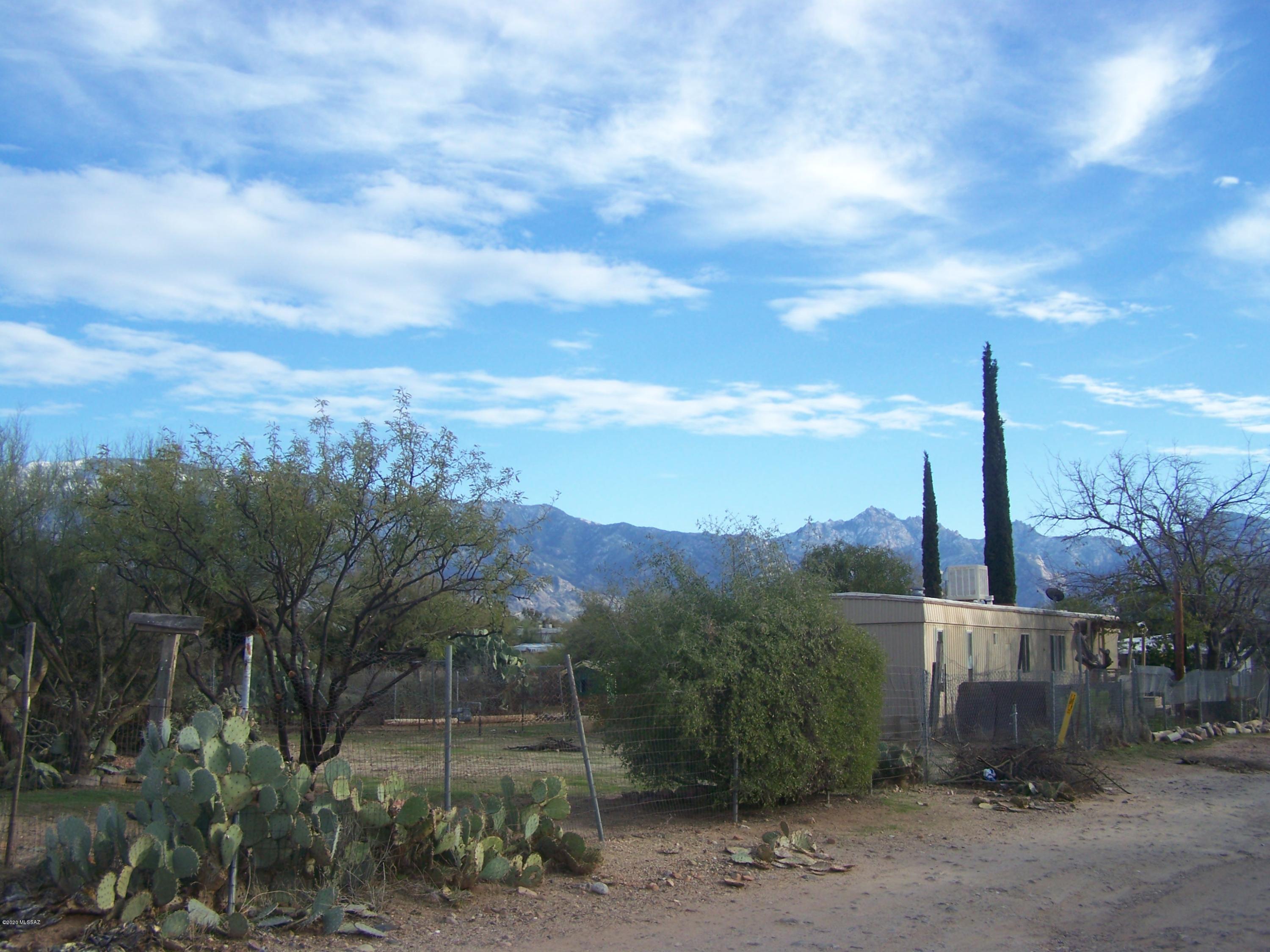 Amazing mountain views! Just over an acre in a great location.Repair the existing 2 bedroom mobile or build your dream home!