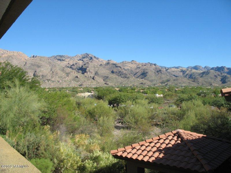 Upstairs 2br/2bath split floor plan condo within a 24 hr Gated access Community. 2 sparkling pools with spas, 24 hr fitness center, 8 gas bar-b-que Ramadas, Sand Volley ball Court, +++! Located in Ventana Canyon, minutes from Sabino Canyon Recreation area, shopping and dining. Well thought out split floor-plan, both bedrooms feature a walk in closet, both sides of the condo boast their own linen closet. All appliances including a full size washer and dryer. Private balcony. Wood floors throughout means NO CARPET!! Concrete counter tops in the open kitchen which also includes stainless steel appliances.