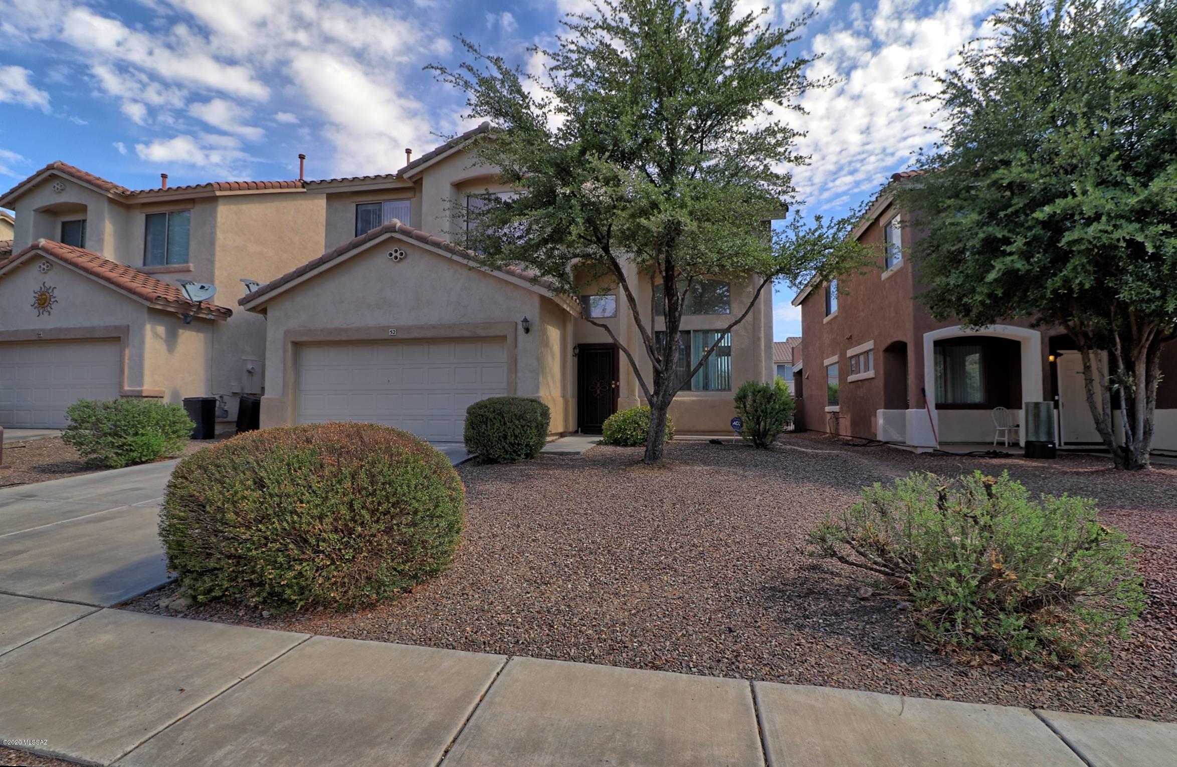 Upon entering this home you are welcomed by a formal living & formal dining room with 19' tall ceilings and a grand stair case. The family room is all tile with a gas fireplace and is open to informal eating as well as the spacious kitchen. The Kitchen has upgraded cabinets, counter-tops and an island. Upstairs an elegant master suite awaits with a large bathroom w/ separate tub & shower, walk in closet and separate sitting room. Two more bedrooms, a full bath & loft space are also upstairs. 2-car garage with remote openers and a spacious back yard complete this Rancho Sahuarita home and also includes all neighborhood amenities like: lake, pools, parks, club house and a state of the art work out facility.