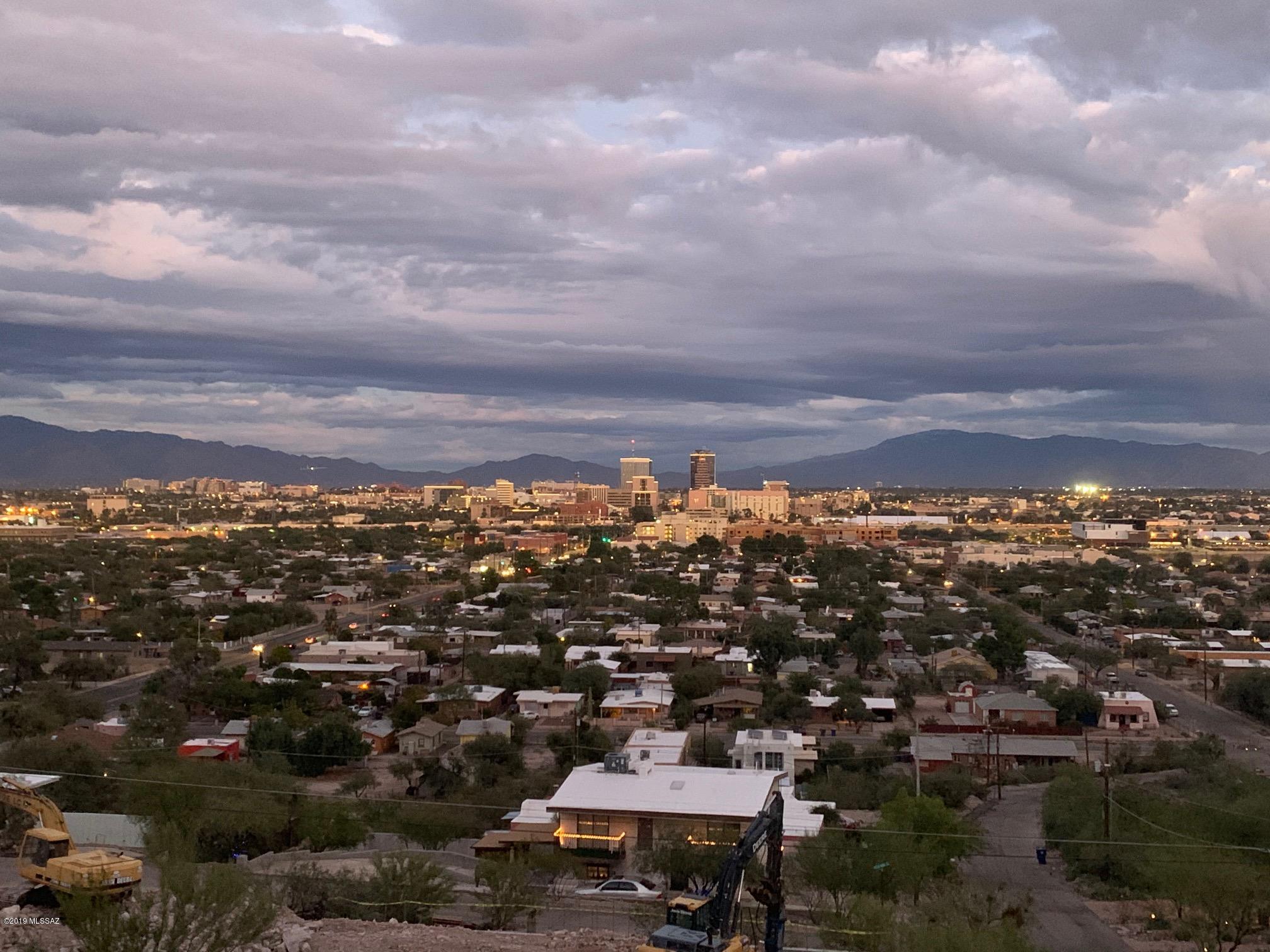 VIEWS, VIEWS, VIEWS are NUMBER 1 with this lot!  Million Dollar views of Downtown Tucson, A-Mountain and the ENTIRE Tucson Metro area are here...you are above it all! BIG .42 ACRE lot gives plenty of room to sit a wonderful home and really take in the sunrises, sunsets and monsoons as they sweep across the valley. Buyer to verify the development requirements for their intended uses as well as all utilities.  Per Google this lot is literally 5 minutes from Seis at Mercado San Augstin as well as 5 minutes from the top of A-Mountain and Downtown Tucson is just 9 minutes away!! Pop up and check out this opportunity to buy that build lot you've always wanted!!  OWNER WILL CONSIDER CARRYING WITH THE RIGHT OFFER...