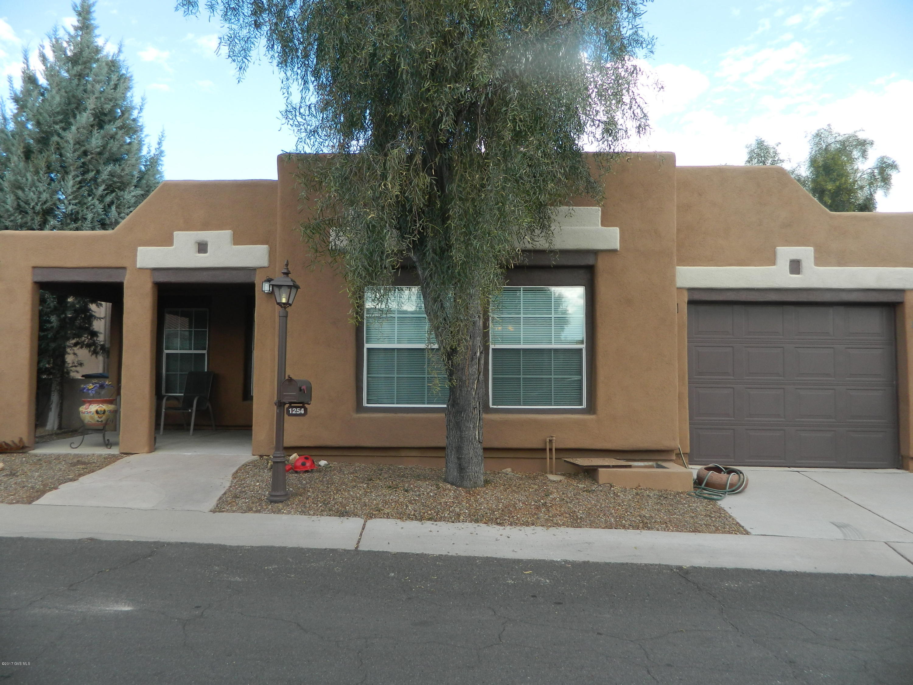 This is a great home in an active adult community with lots of amenities, It is 1080 sq. ft., 2 bedrooms, 2 bathrooms, an Arizona Room, and 1 car garage. In 2013 new carpet in Living room and Master bedroom, new Laminate in 2nd bedroom or den and new Vinyl in kitchen and Arizona room. In 2014 a new refrigerator, gas stove and Microwave was put in. Also in 2013 a new Goodman gas pac was put in. This past year they put in a stainless steel kitchen sink and a garbage disposal. There is a screed in patio in the back and a nice front porch area for Happy Hours. I almost forgot that in 2015 the roof was re-coated and the exterior of the house was painted. Wow this house is ready to move into!