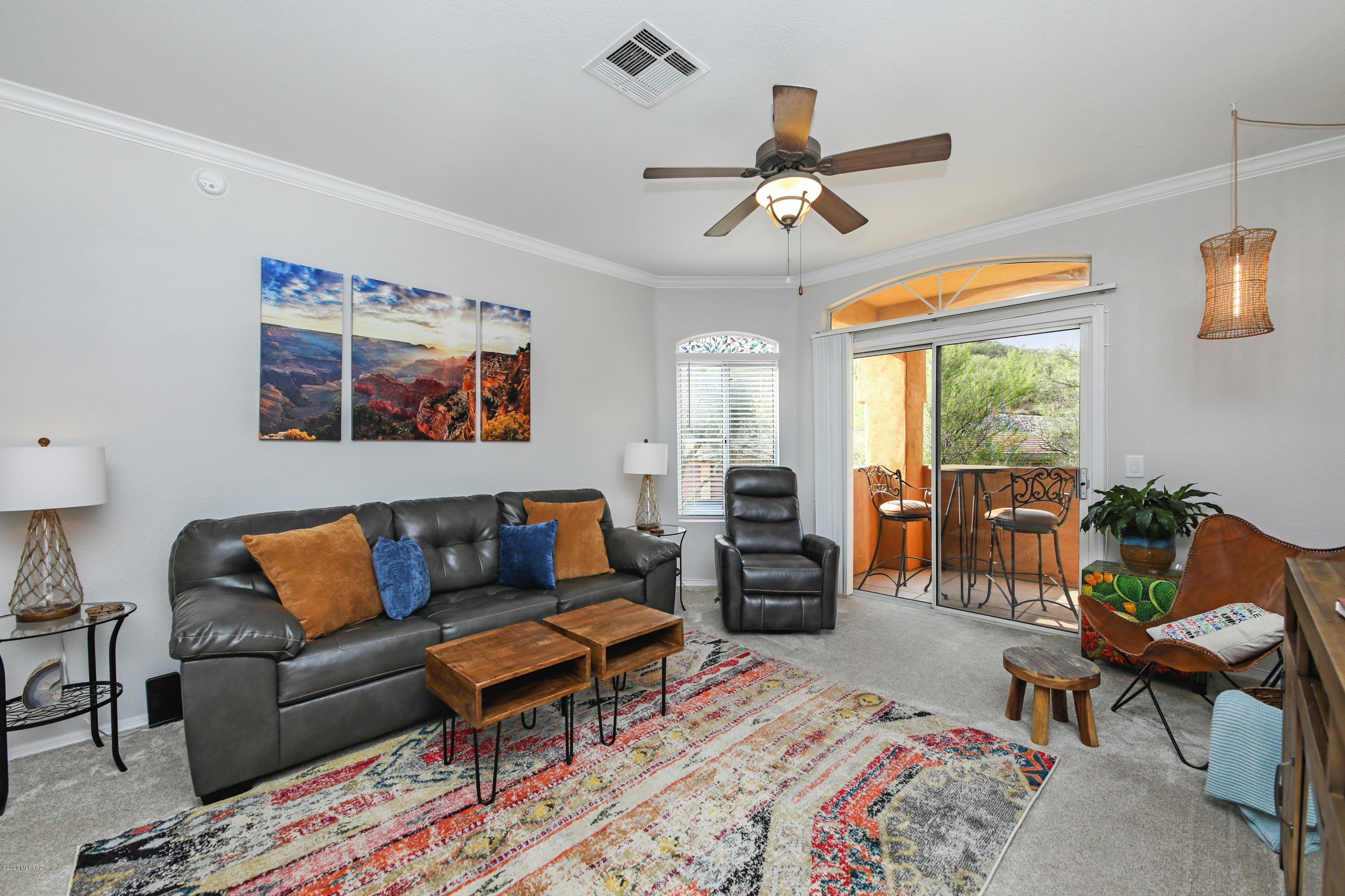 Resort style living at its best! This clean, contemporary, recently renovated condo truly captures the essence of an open concept layout & is being sold turn key! High ceilings with crown molding, tons of natural light, crisp white paint & pride of ownership shines throughout this well appointed unit. The great room commands the attention of this home with a entertainment/fireplace credenza, & is perfect for an intimate entertainment space. Cozy balcony to enjoy the fresh air & listen to the sounds of nature or just relish in the peace and tranquility of quietness (unit is located on the south end of the complex so not on the Sunrise Drive side). The icing on this cake is this gated condominium community features lush landscaping, a beautiful community pool & spa, exercise facilities, & so much more! Prime location to enjoy our beautiful outdoors... very close proximity to hiking at Sabino Canyon & golfing at Loews Ventana Canyon. Would be absolutely perfect as a starter home or an investment opportunity allowing 30 day leases. Hurry, come see this gorgeous pad today before someone else beats you to the punch. Come & fall in love!