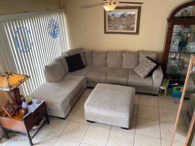 New Reduced Price! Central Tucson 2bed/1.5 bath remodeled head to toe co-op! Everything has been done, bring your clothes and move in! Dual pane windows/French doors, Mini-split AC/heat units, ceramic tile floors. Kitchen remodeled with big pantry, all appliance stay, washer and dryer included. Huge master bedroom with windows to bring in lots of light! Both bathrooms are so nice with the upstairs bathroom containing a beautiful walk-in shower. Fenced-in outdoor covered patio is landscaped so beautifully that the hummingbirds love to hang out!  This is a must see. Cash only, no rentals. Monthly fee includes property taxes, water, trash, sewer, building insurance, roof, pest control, pool, common grounds and more! Pictures were taken while the owners lived in the unit.