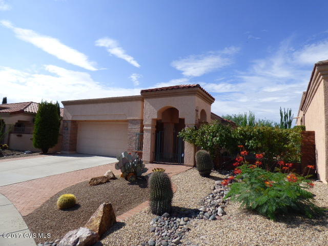 VIEWS, VIEWS and VIEWS!!! Outstanding San Ingnacio Home, Custom Lantana floor plan, with some of the best views in Green Valley. You enter into your own private rose garden, 2 master suites, an office, custom fireplace, tile floors, spa tub at Master Bath. Over sized garage with room for a golf cart or work shop. This low care yard would be great for entertaining, outstanding patio and landscaping, Citrus, Roses and more. Must see !!!!