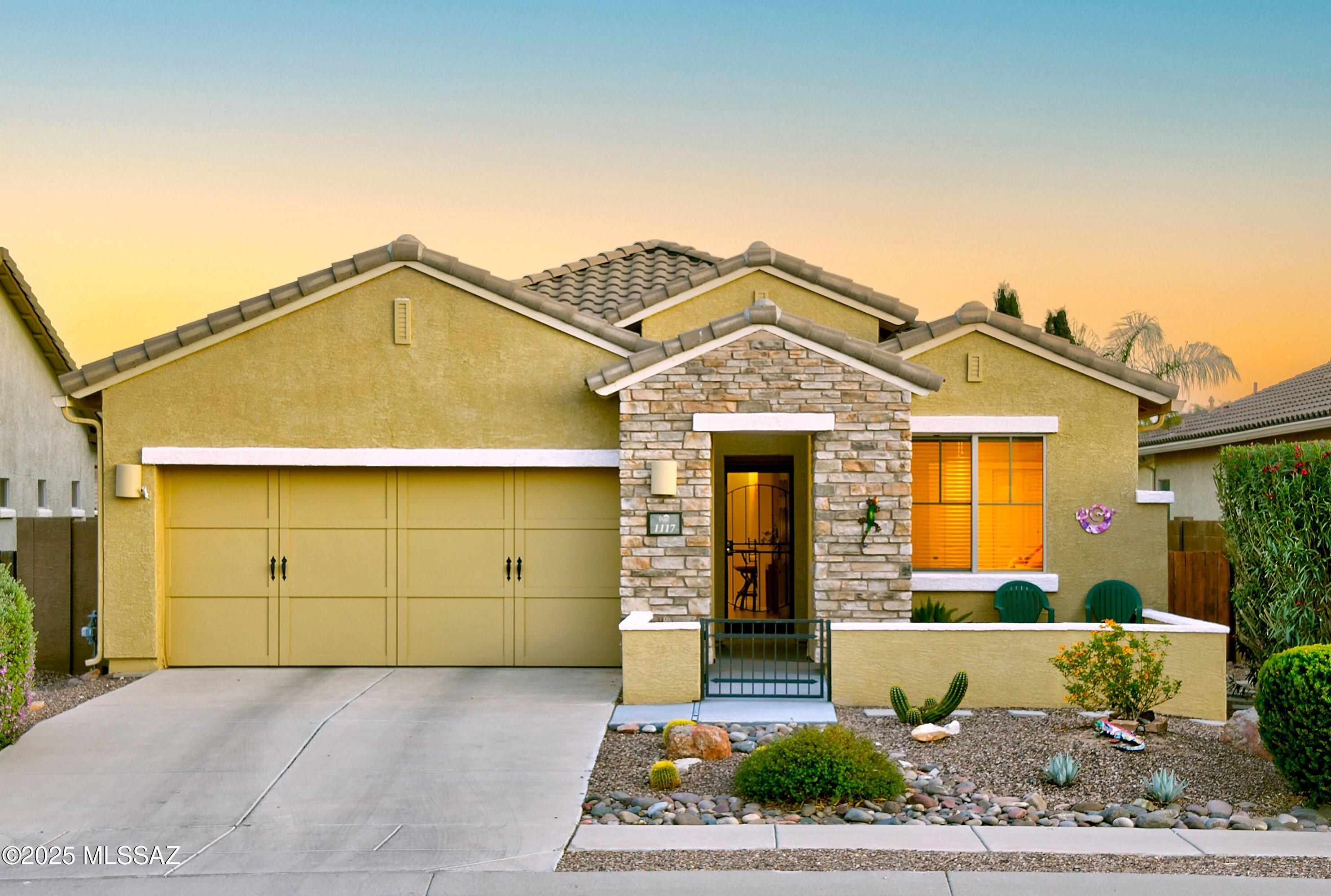 Welcome to comfort, style & Sonoran beauty in the heart of Oro Valley! Charming stacked stone courtyard entry sets the tone as you step into the foyer w/elegant architectural details. Expansive greatroom w/cozy fireplace, media niche & lrg dining area, ideal for entertaining. Generous kitchen w/granite counters, abundant cabinetry, W/I pantry & gas range. Spacious primary w/bay windows, lrg  W/I closet, dual sinks, soaking tub, & sep W/I shower. Split plan, ceramic tile in all the right places, 2 addl bedrooms, full guest bath & den provide flexible living. Enjoy the backyard w/covered patio, flagstone pavers & easy-care landscaping. Ideally located near the neighborhood park as well as the Rancho Vistoso Nature Preserve w/6.2-mile paved trail & views of the Catalina & Tortolita Mountains