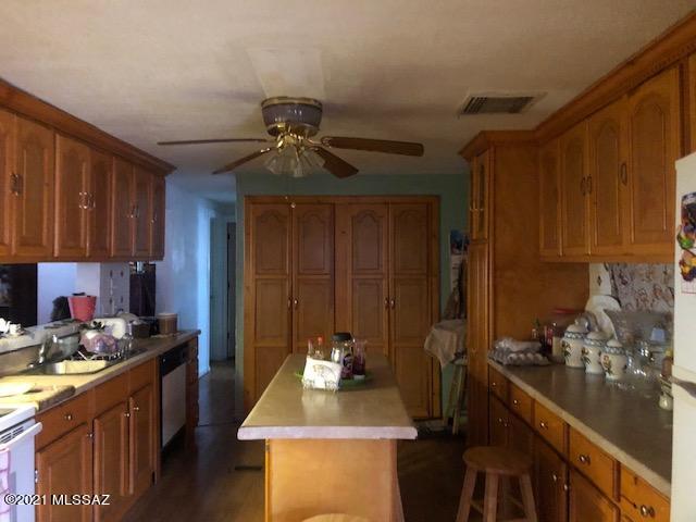 Great Investment Opportunity! 
Spacious main house is an affixed 1978 1440 SF manufactured home with 3 Bdrms/2 baths, split bedroom floor plan, master bedroom has on suite bathroom, large kitchen w/new cabinets and counter tops, island, with two attached additions rented as studios.  All have separate entrances.  In addition, there is a separate 1 bedroom/1 bath 500 SF guest house that sits back from the main home.  Owner lives is main home and rents both studios and guest house for additional income.  Currently all are occupied with a combined monthly rent income of $1550 per month including utilities. No permits on the additions or the guest house. Main home comes with a covered carport.
