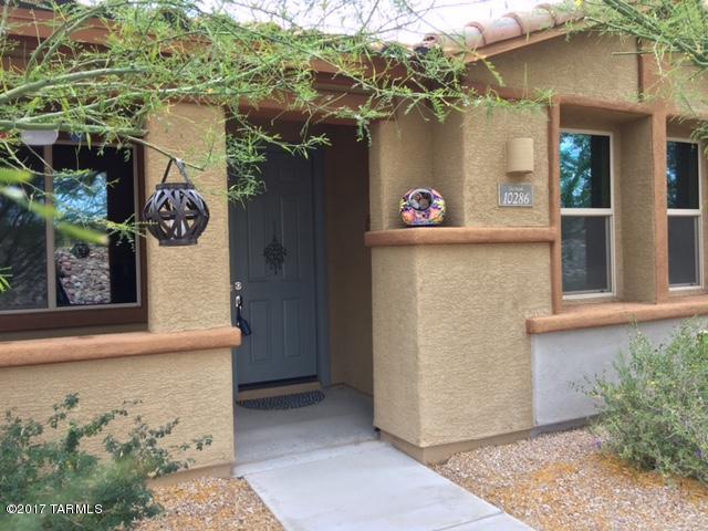 Beautiful home in Del Webb’s active 55+ community...you won’t want to miss this! This bright, move-in ready home offers a gourmet kitchen w/ island/breakfast bar, gas cooktop, SS appliances, plentiful cabinets & counter space, upgraded 18” tile, carpet & many green features, including owned solar panels that will reward you each month w/ a lower electric bill. Open living area is perfect for entertaining; the split bedroom plan offers privacy for guests, the den provides space for TV, hobbies or an office. Charming outdoor fireplace on the patio & the east-facing front porch add to your outdoor living enjoyment. Home faces east w/ no neighbors between you & the Rincon Mtns! Community offers golf, a clubhouse w/ heated pool/spa, tennis, gym, billiards, craft room and much more!