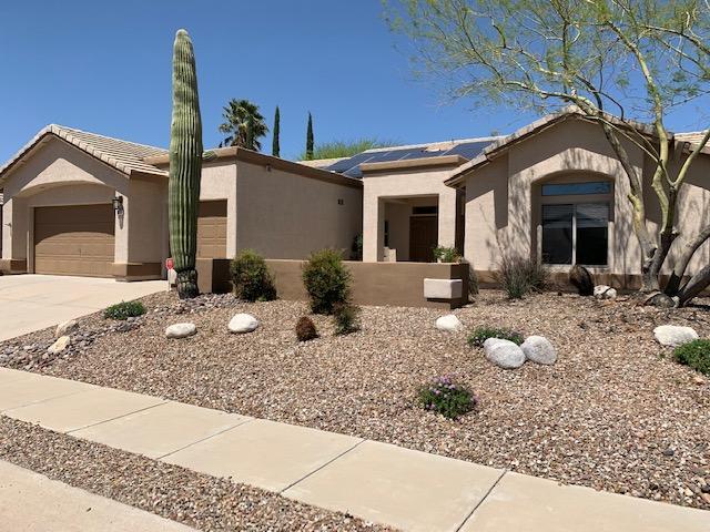 Welcome home to your spacious, turn-key, 3 Bedroom, 2.5 Bath, in highly desired, sought after Canada Hills neighborhood. Immaculate home with updates abound inside and out! Attractive neutral tile graces the entire home. Vaulted ceilings make this home bright and cheery with open living in your Family Room and inviting gas fireplace. Gourmet kitchen has rich wood cabinets, a versatile island, gas range, striking granite counters, tile backsplash, under cabinet lighting and a breakfast bar. Spacious master bathroom has oversized shower with tile surround, and updated lighting and mirrors. Mature landscaping everywhere, with an extra high wall for added privacy and solitude. Security Doors.  Conveniently located near golf, OV Rec Center, restaurants and shopping. Amphitheater School