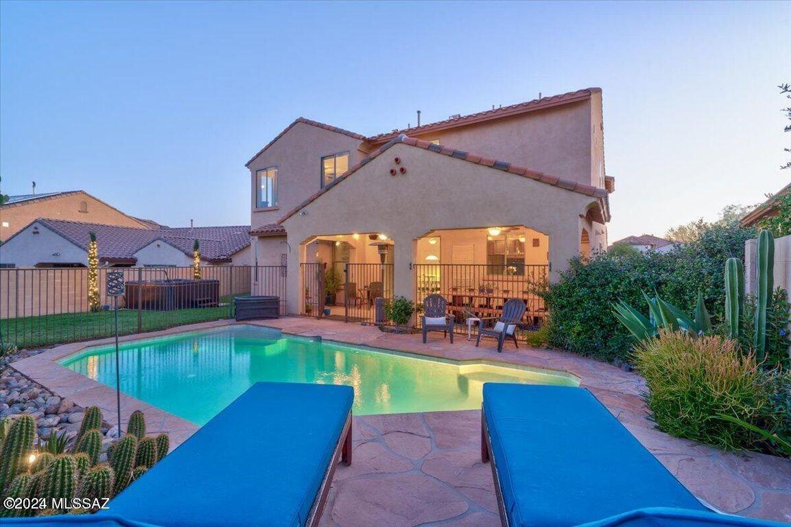 Back on market due to buyer financing. VA assumable loan with 2.25% interest rate in GATED community with entrance to K-8 school! Backyard features a fenced POOL with waterfall, covered patio and HOT TUB. Main level features guest quarters with full bath & separate entrance, office/den, laundry, spacious family room, AND a stunning chef's kitchen with BUTLER PANTRY & Walk-in pantry, granite counters/backsplash, center island, and upgraded cabinets with pull-out shelves. Upstairs includes impressive primary bedroom with large walk-in closet, 2 additional bedrooms also with walk-in closets and a sizable loft. 3 full baths in all with vaulted ceilings and vinyl wood flooring to include stairs. Side yards include RV hookup and greenhouse! HOA includes Clubhouse access for fitness center, multiple pools, tennis courts, etc